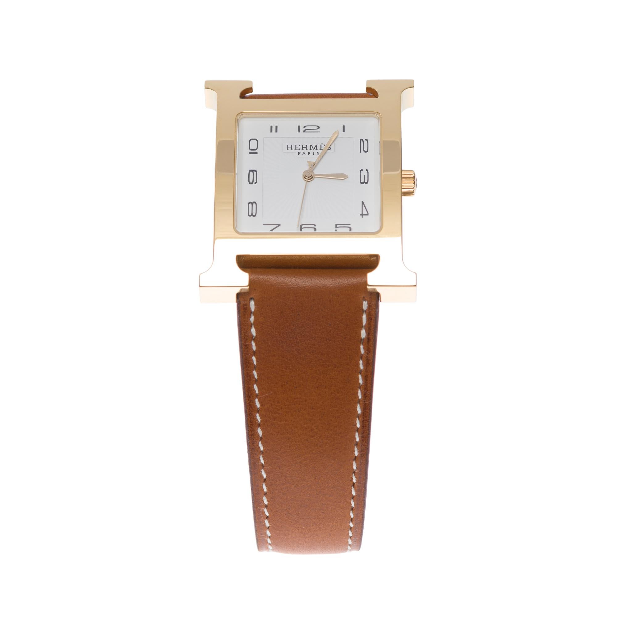 Very Classy Hermès Heure H Grand modèle Watch

Large model, 34 mm
Horn to horn height: 34 mm
Case width: 30 mm
Yellow gold plated steel box
Anti-reflective sapphire crystal
White dial, striking sun
Quartz movement, made in Switzerland
Function: