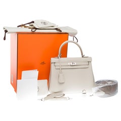 New Hermès Kelly 25 retourne Handtasche mit zwei Riemen aus Beton Togo Leder, PHW