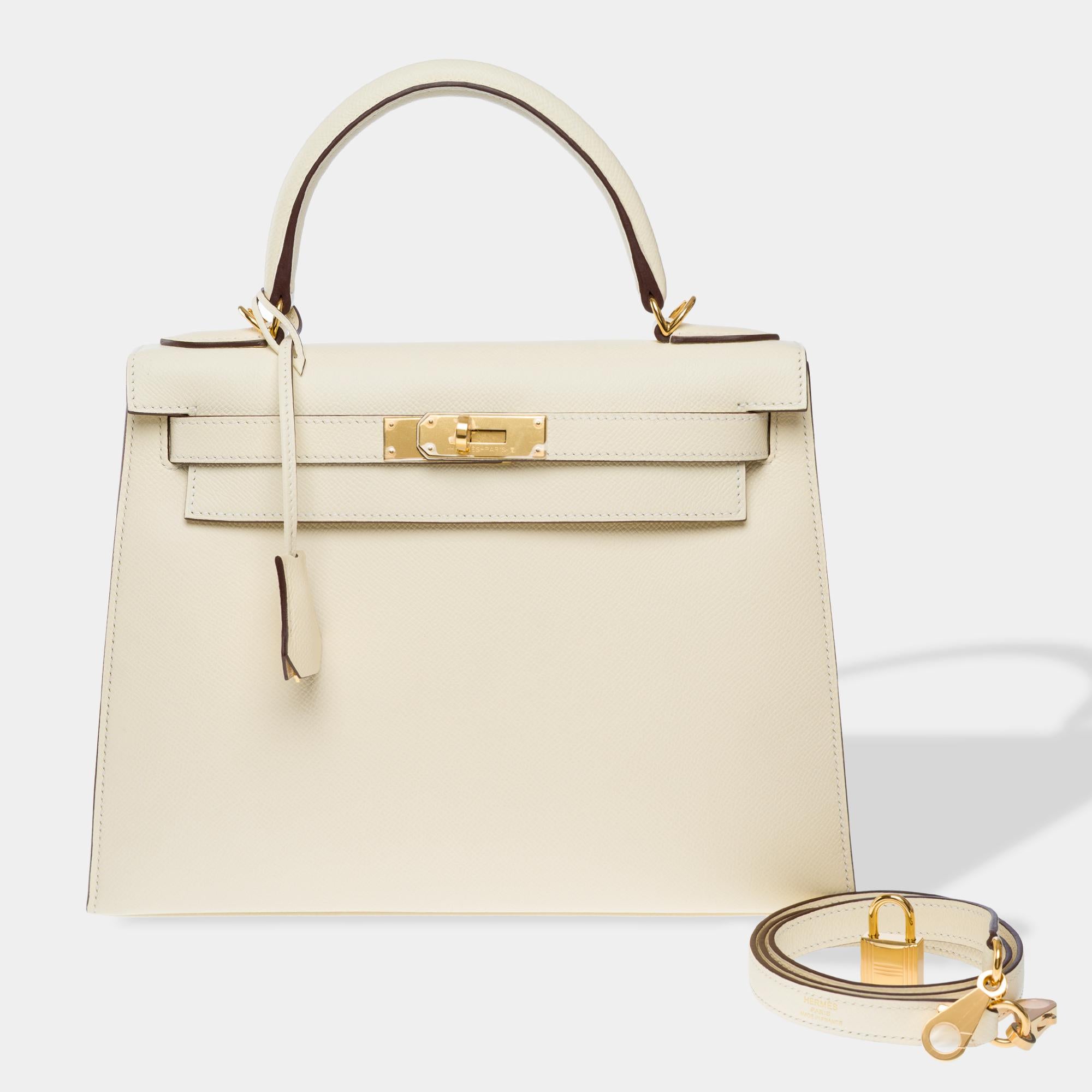 Stunning​ ​Hermes​ ​Kelly​ ​28​ ​Sellier​ ​handbag​ ​strap​ ​in​ ​Nata​ ​Epsom​ ​calf​ ​leather,​ ​gold​ ​metal​ ​trim,​ ​cream​ ​leather​ ​handle,​ ​and​ ​removable​ ​cream​ ​leather​ ​shoulder​ ​strap​ ​allowing​ ​for​ ​hand,​ ​shoulder,​ ​or​