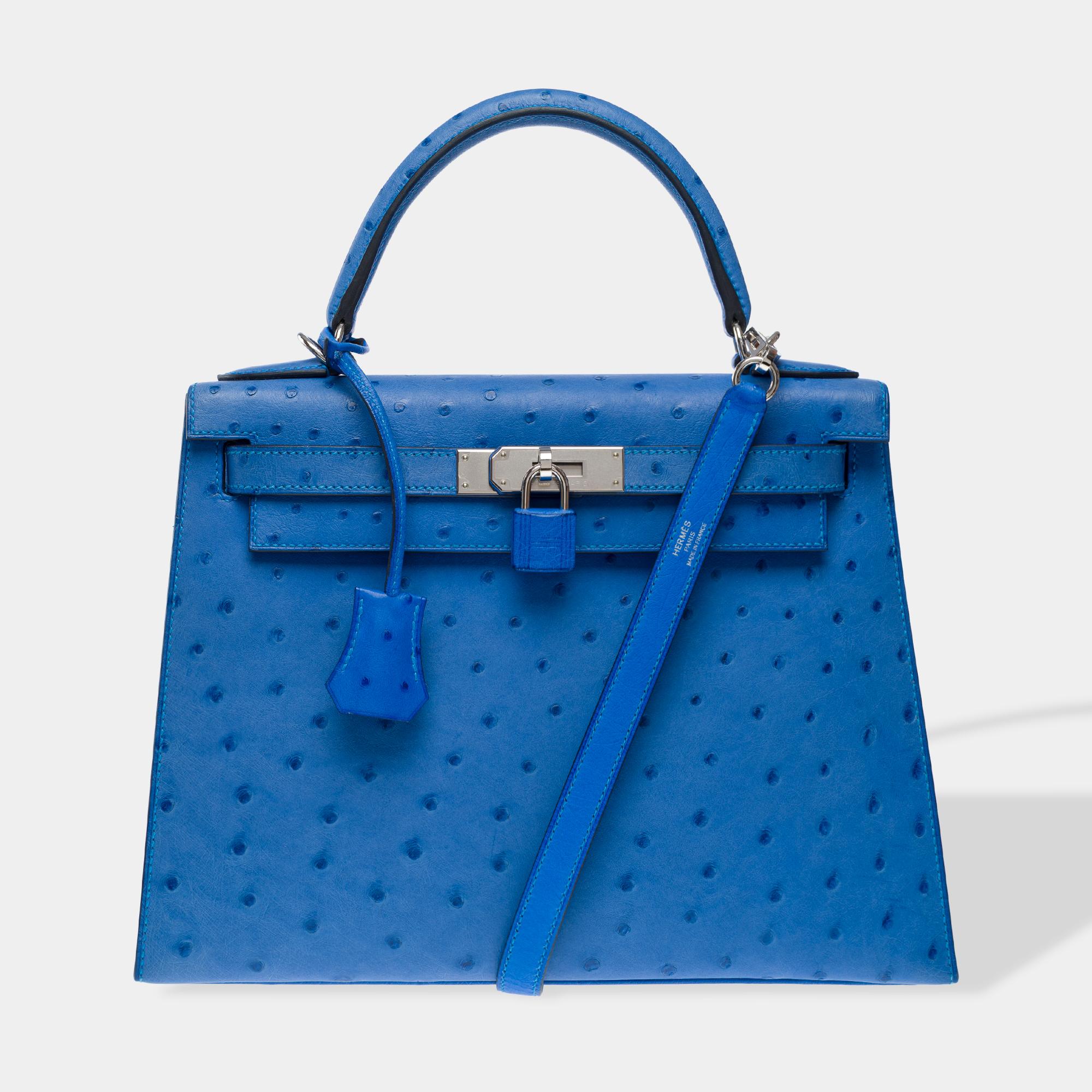 Exquisite​ ​Hermes​ ​Kelly​ ​28​ ​handbag​ ​strap​ ​in​ ​Blue​ ​Bleuet​ ​ostrich​ ​leather,​ ​silver​ ​metal​ ​palladium​ ​trim,​ ​blue​ ​ostrich​ ​handle,​ ​removable​ ​strap​ ​in​ ​blue​ ​ostrich​ ​allowing​ ​a​ ​hand​ ​or​ ​shoulder​ ​or​