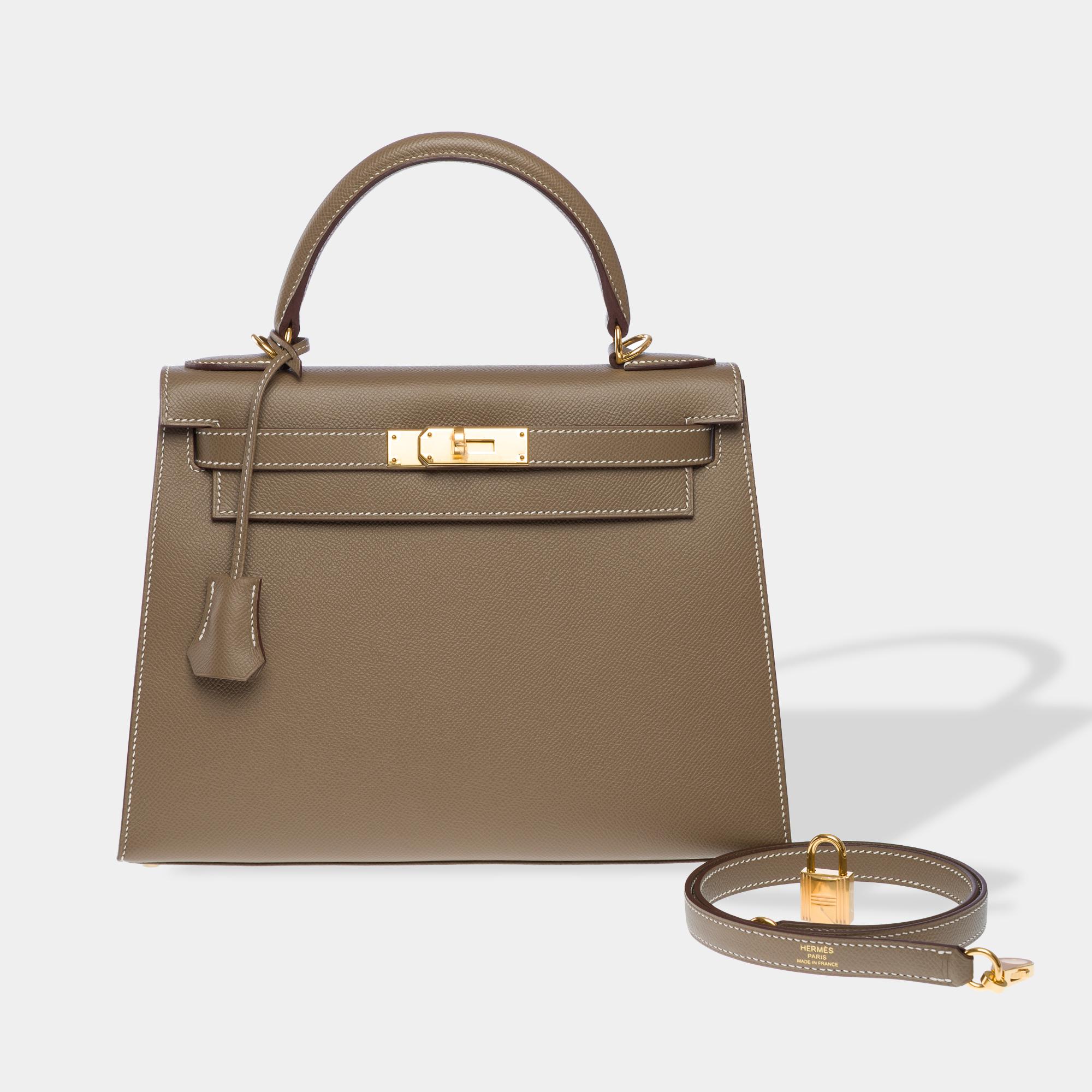 Stunning​ ​Hermes​ ​Kelly​ ​28​ ​Sellier​ ​shoulder​ ​bag​ ​in​ ​Etoupe​ ​Epsom​ ​leather,​ ​with​ ​gold​ ​metal​ ​trim,​ ​grey​ ​leather​ ​handle,​ ​and​ ​removable​ ​grey​ ​leather​ ​shoulder​ ​strap​ ​allowing​ ​for​ ​hand,​ ​shoulder​ ​or​