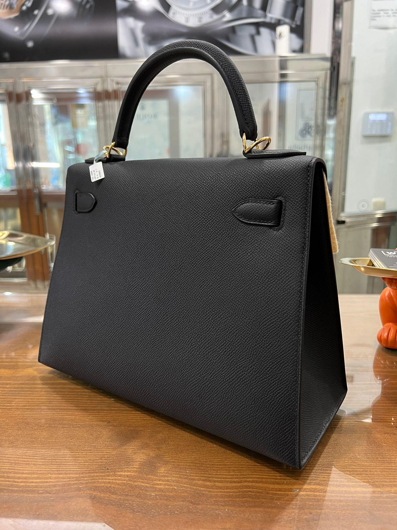 Hermes Kelly 28 Sellier Noir Black Epsom Gold Hardware 
New Never used. A Collectors Piece
Measurements : 22cm High x 28cm Wide x 10cm Deep
The Kelly bag came to success when it was first paparazzied on the bumpy belly of Princess Grace Kelly in