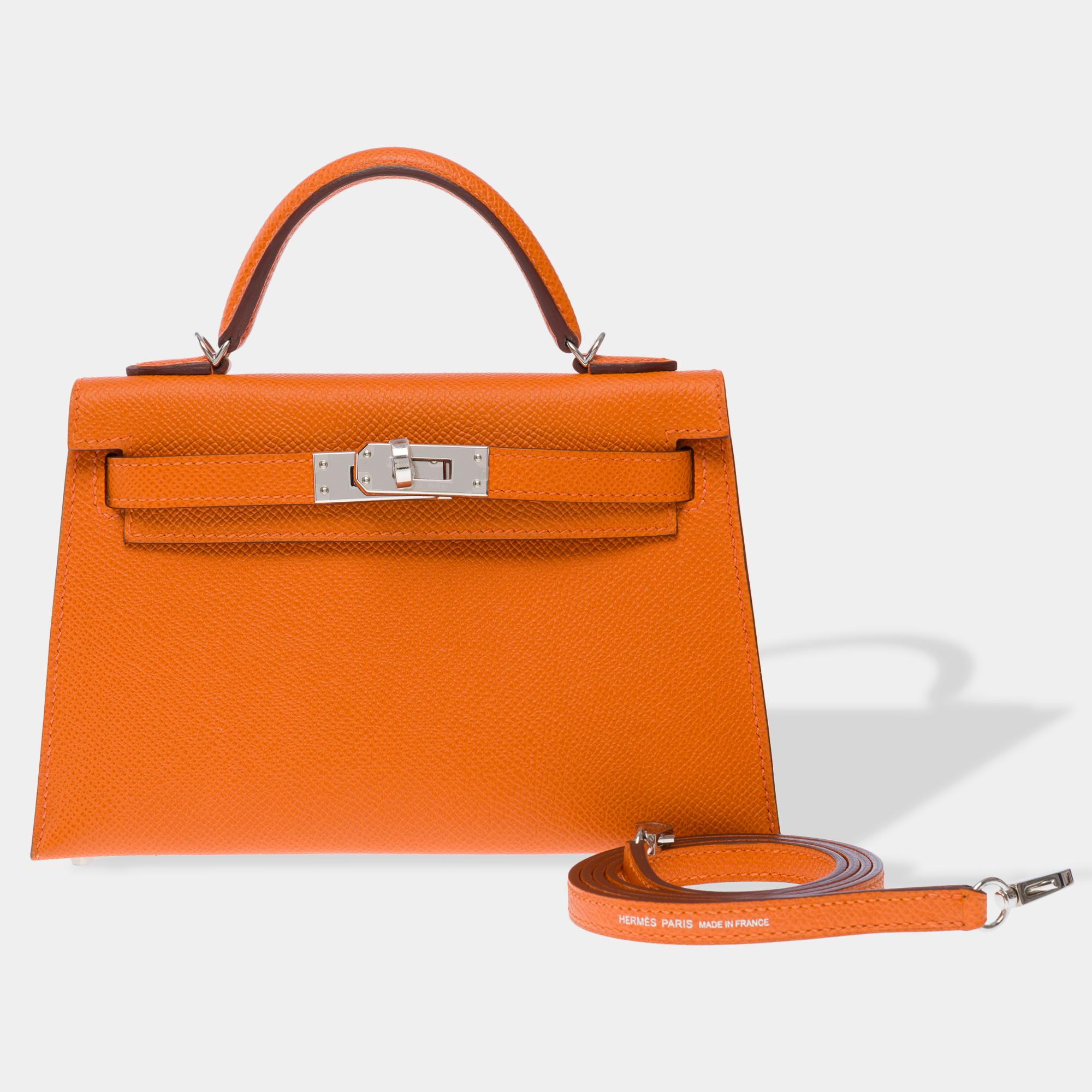 Exceptional​ ​Hermes​ ​Mini​ ​Kelly​ ​20​ ​handbag​ ​strap​ ​in​ ​Epsom​ ​calfskin​ ​Orange​ ​H​ ​leather,​ ​silver​ ​palladium​ ​trim,​ ​Orange​ ​leather​ ​handle,​ ​Orange​ ​leather​ ​shoulder​ ​strap​ ​allowing​ ​a​ ​hand,​ ​shoulder​ ​or​