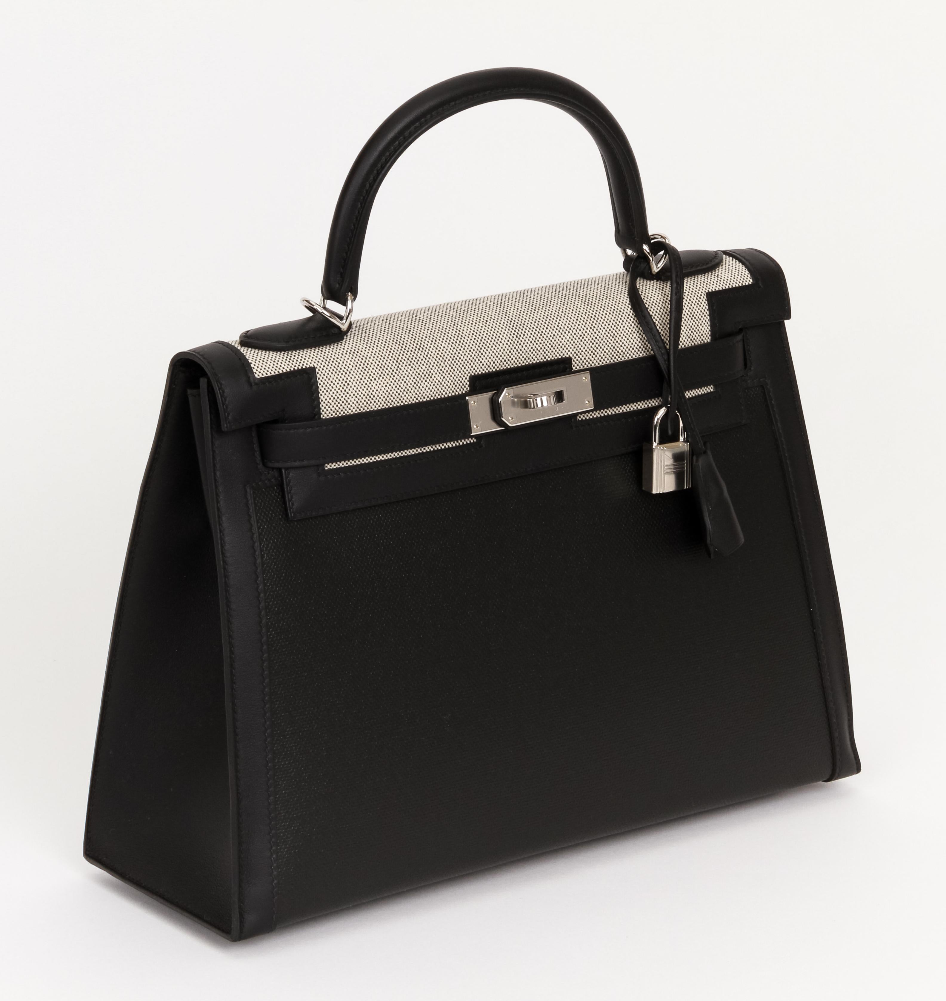 Hermes one of a kind currently for sale Kelly II sellier Berlin, ecru toile and black swift leather. Palladium Hardware. Specially coated black toile, very durable and lightweight. Letter Z for 2021. Brand new in box. Comes with strap, clochette,