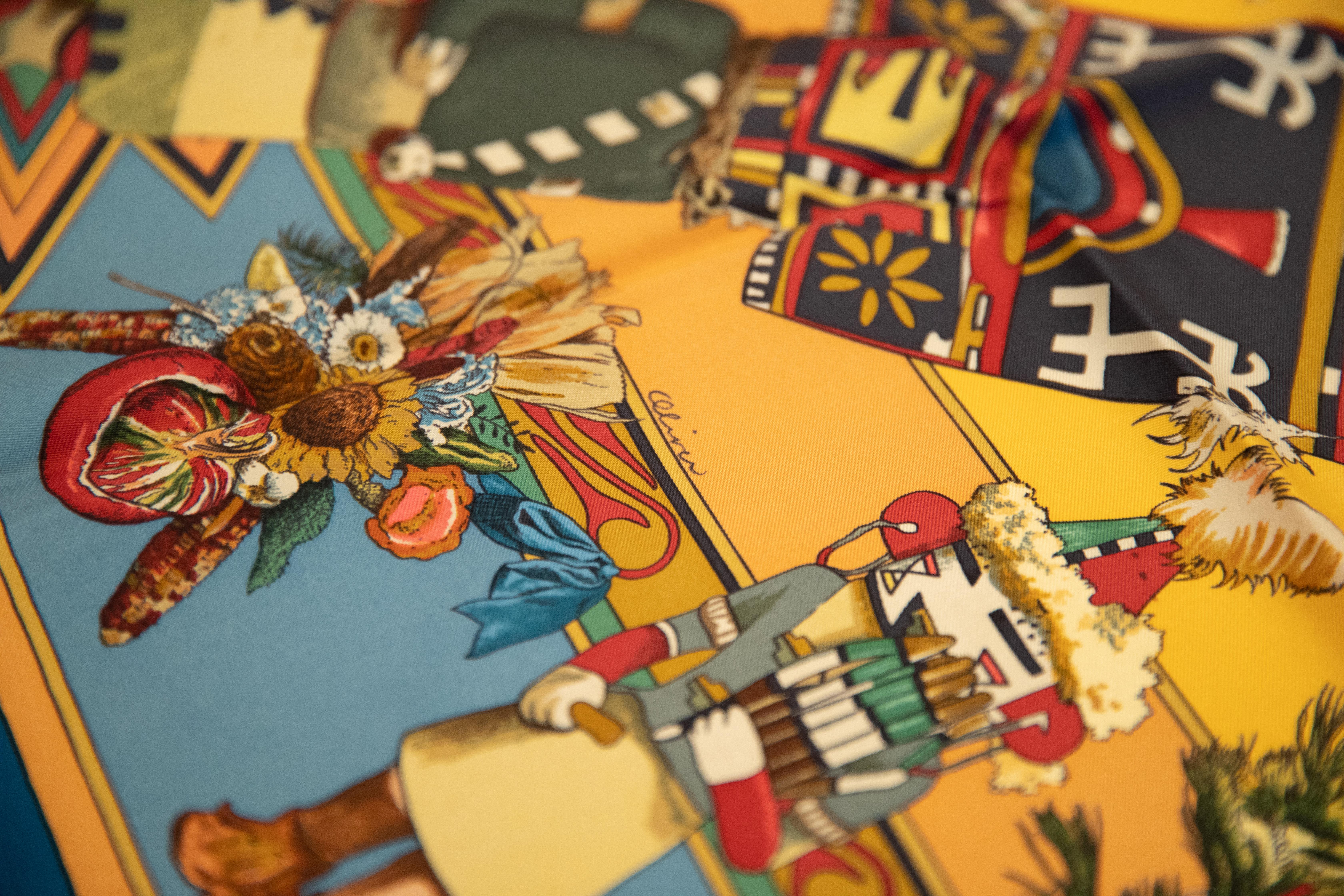 Hermès rare Kachinas teal, blue and yellow scarf designed by artist Kermit Oliver. Signature print from this artist. beautiful silk twill with hand rolled edges. Mint unused condition.