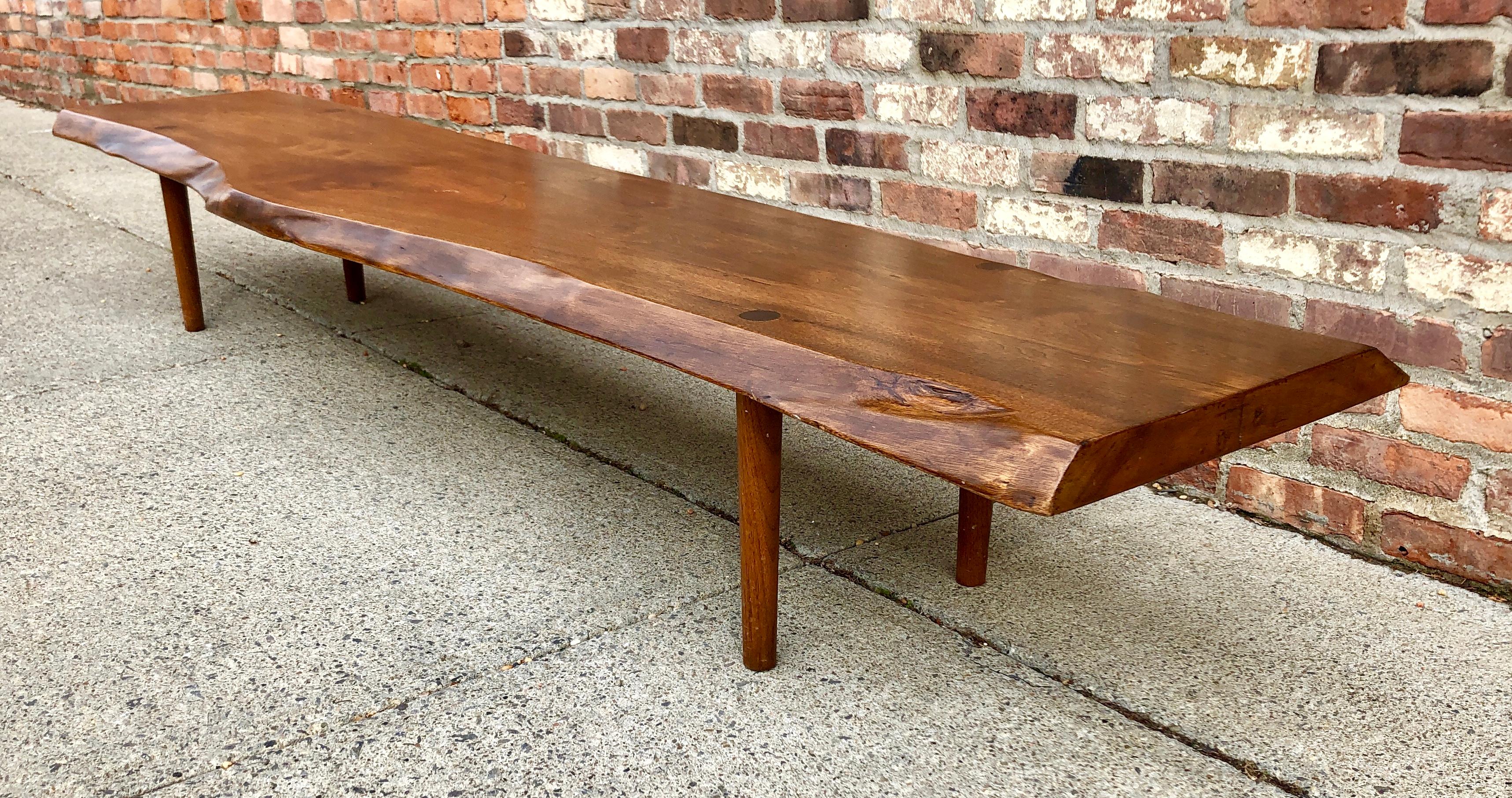 Nakashima style long bench with free-edge and thru-tenon details, circa 1960s. Nice old linseed oil finish. Unsigned.