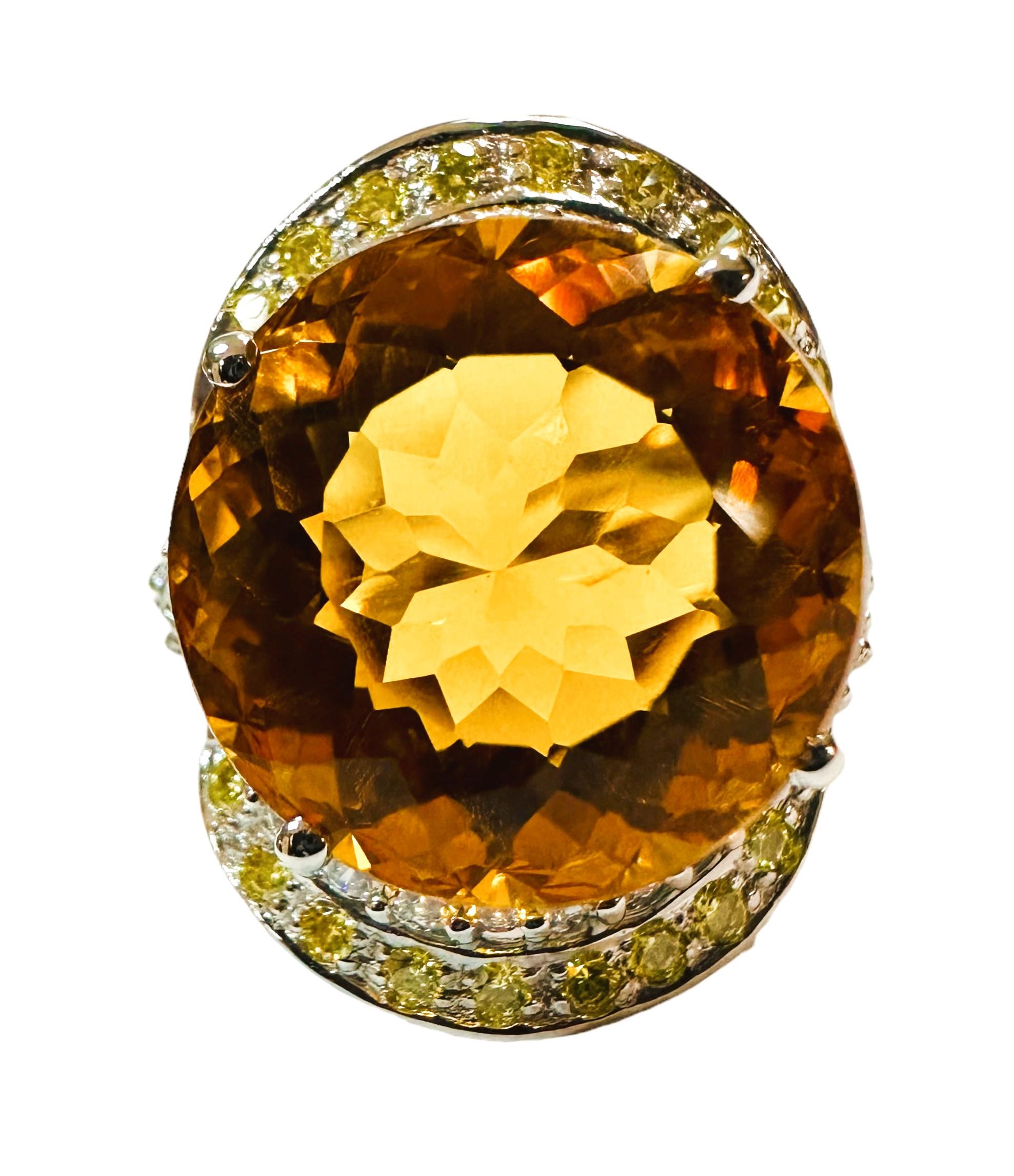What a beautiful ring!  The ring is a size 6.75.  The stone is from Brazil.  A very high quality stone.   It is a fancy round cut stone and is 14 Cts.   The main stone is 15.8 mm round.  It is surrounded by Diamond Cut White Sapphires and they are