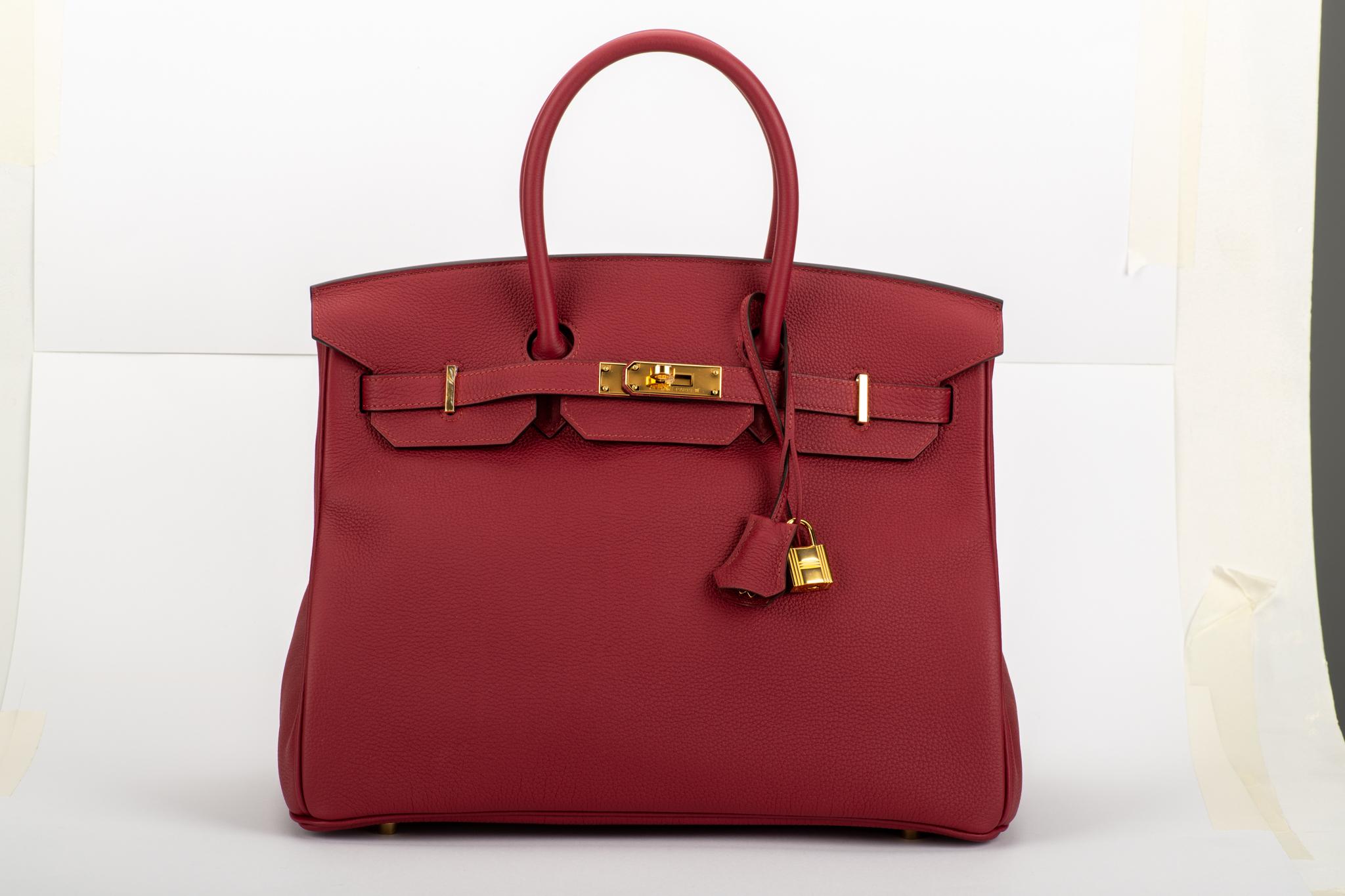 Hermes BNIB birkin 35 cm in rouge grenat togo leather with gold tone hardware. Date stamp C for 2018. Comes with clochette, tirette, two locks, keys, dust cover and original box. Never worn.