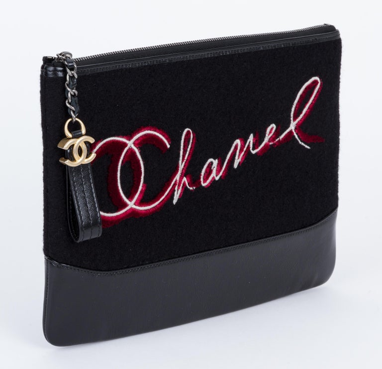 Chanel brand new in box black and red Paris Salzburg clutch. Comes with hologram, id card, booklet, dust cover, camellia, ribbon and box.