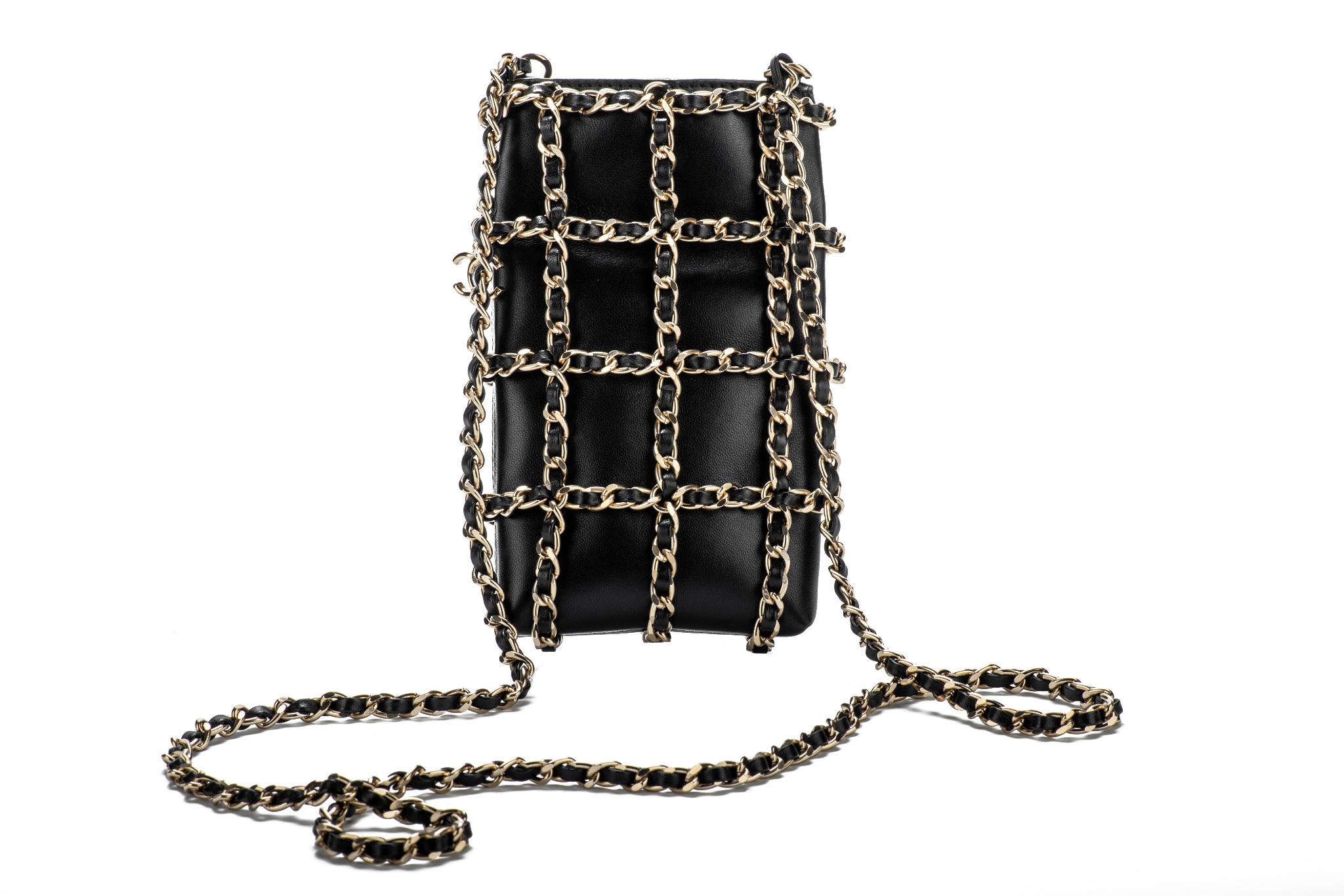 Brand new in box collectible cross body bag. Vip cellular phone bag. Iconic black lambskin leather and gold tone woven chain. Shoulder drop 22.75