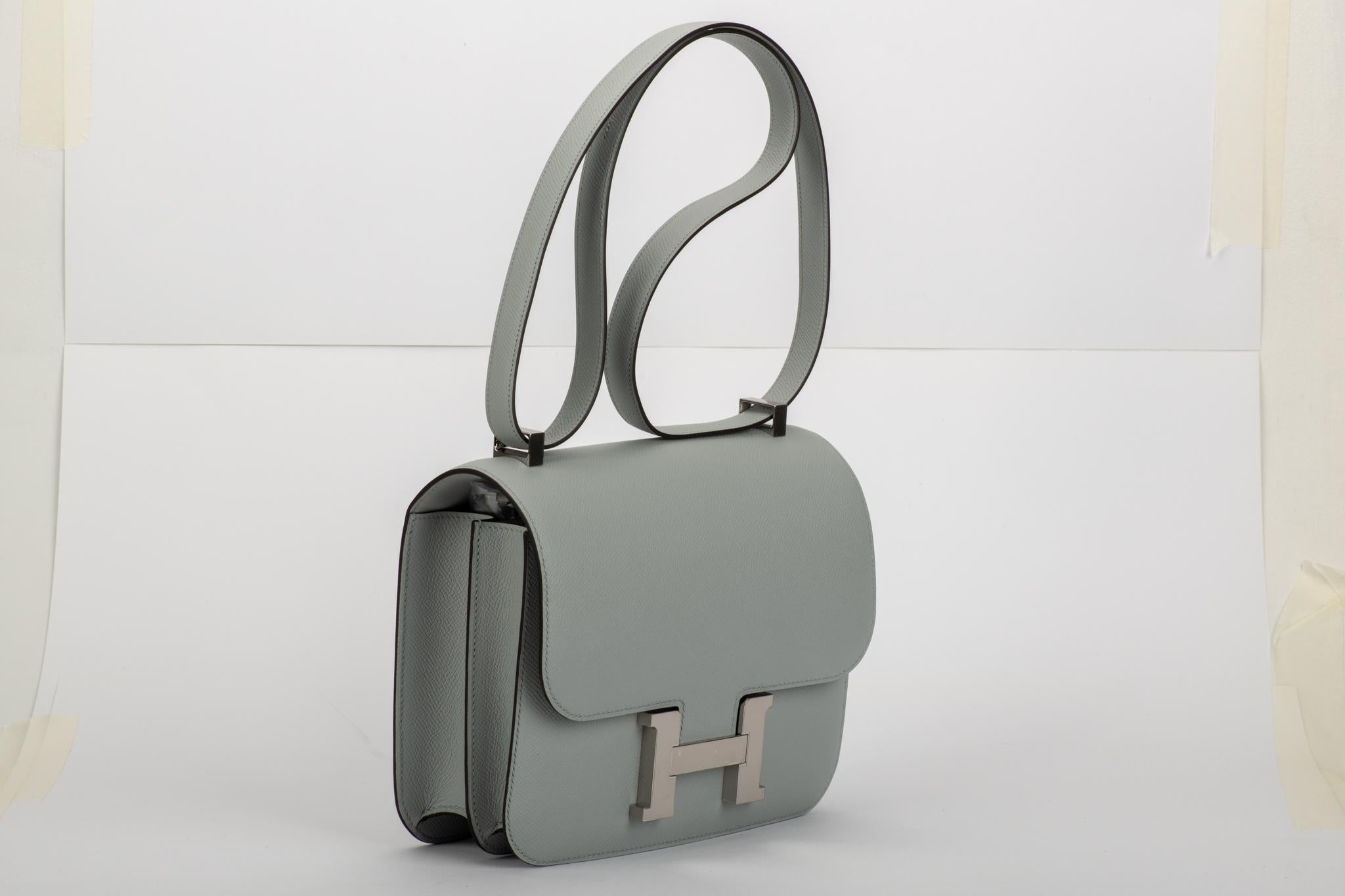 Amazing brand new in box constance 24 cm in Blue Glacier (medium grey) epsom leather and palladium hardware. Plastic on hardware. Shoulder drop 9.5/18. Comes with dustcover, booklet, box, ribbon and shopping bag.
