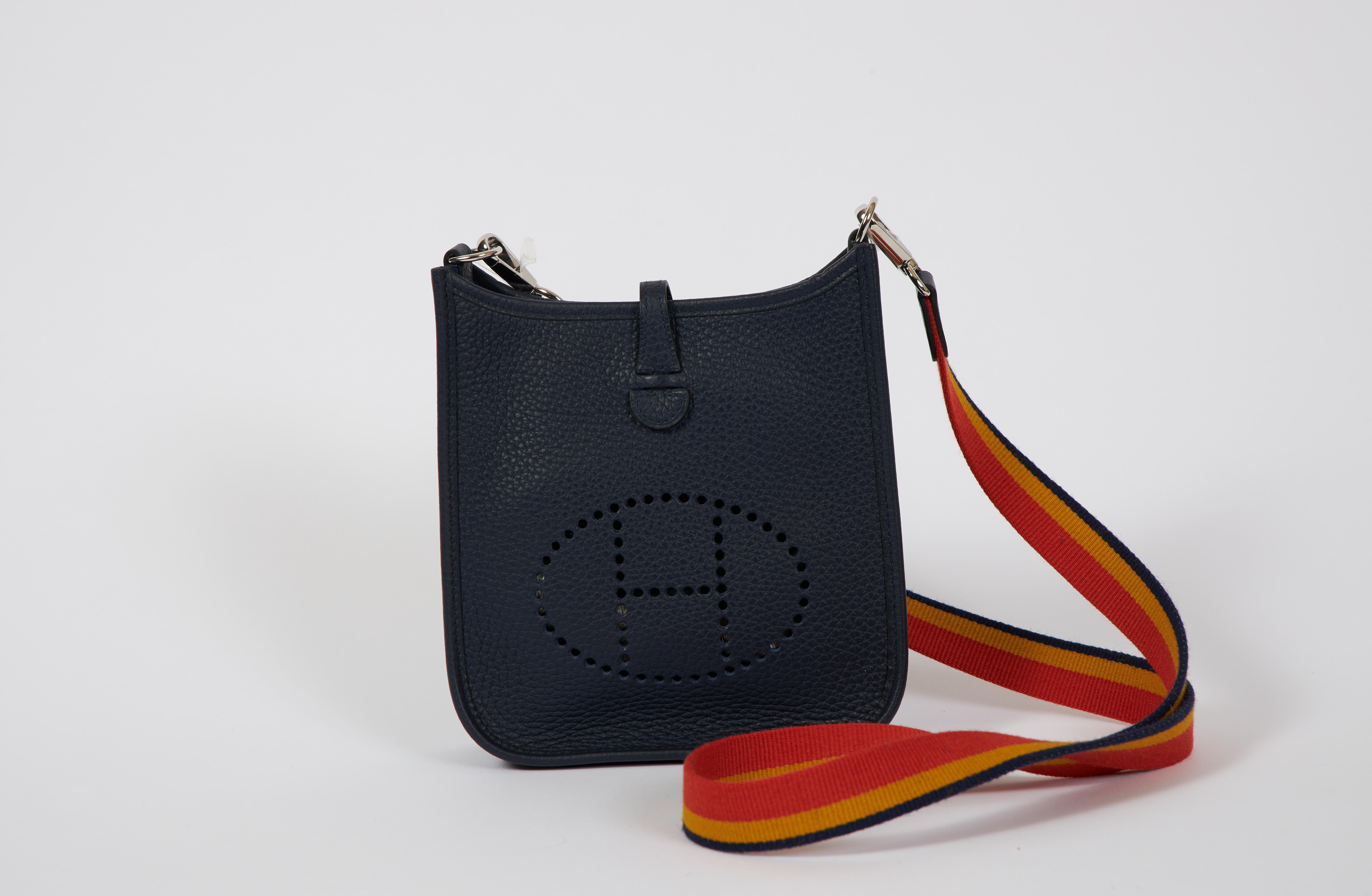 New! Hermès mini evelyne in blue nuit clemence leather with palladium hardware. Multicolor cross body fabric strap, 44