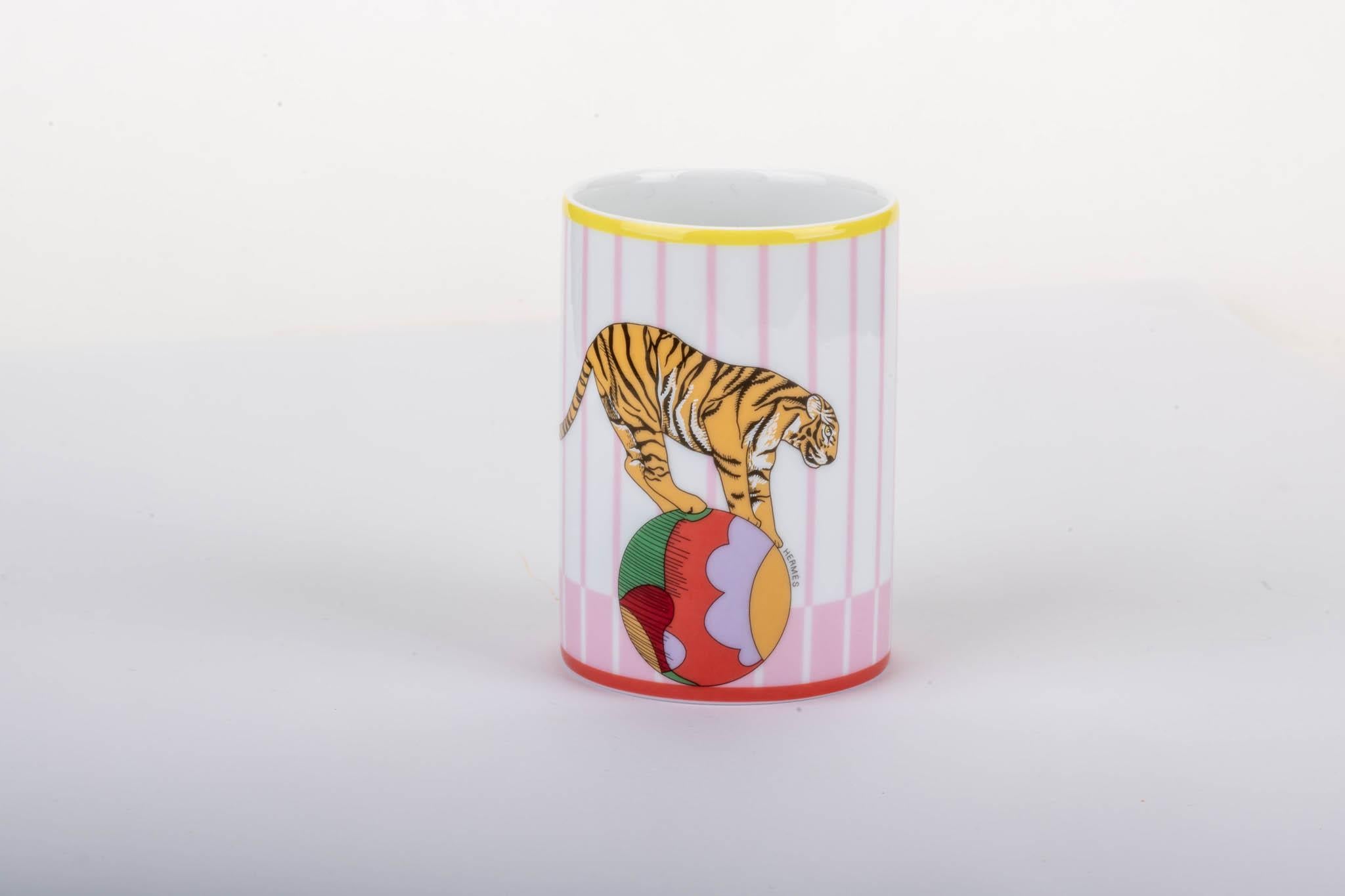 Hermes brand new in box porcelain tumbler , circus collection. Pink and white combination. Colors might contain cobalt.
