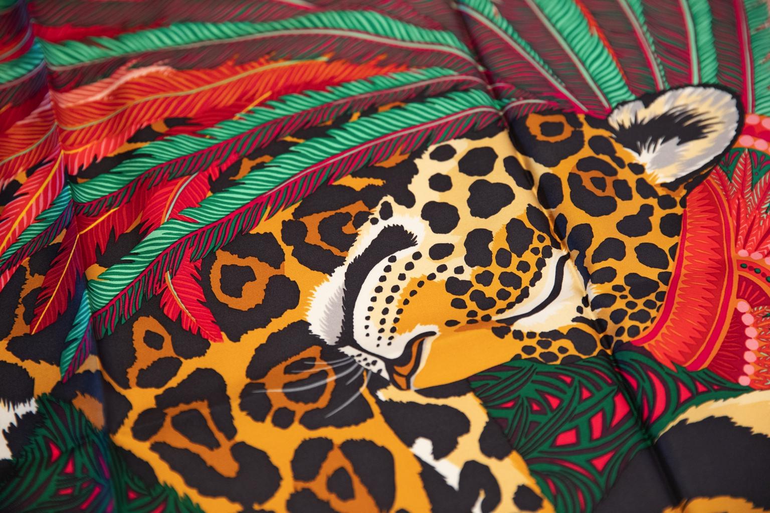 Hermès red silk Jaguar Quetzal scarf designed by Alice Shirley. Hand-rolled edges. New in box.