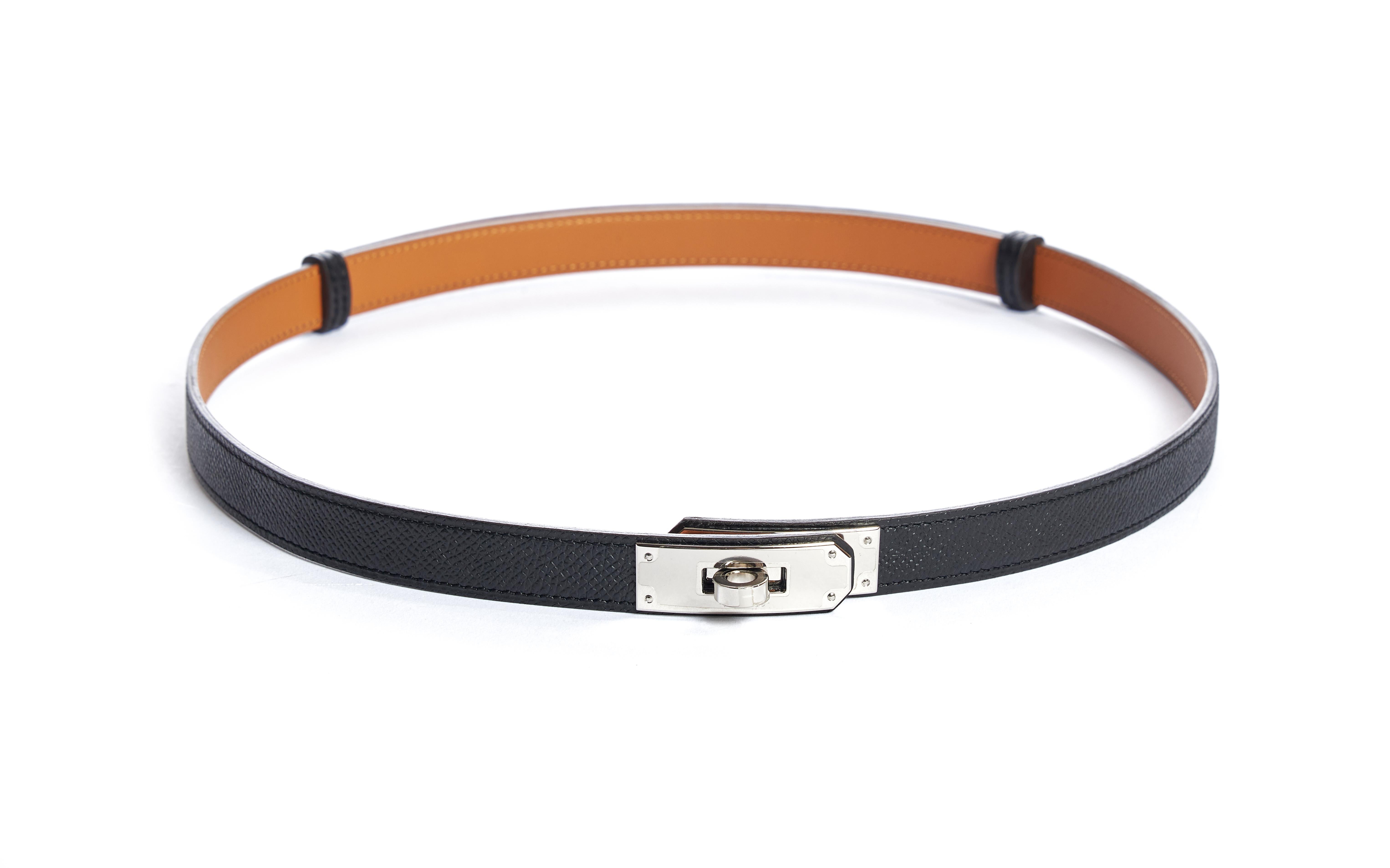 Hermès Kelly belt with signature closure. Black Epsom leather with gold interior. Date stamp T for 2015. Size adjustable; max length 100cm. Comes with dust cover, box, ribbon and gift bag. Never used.