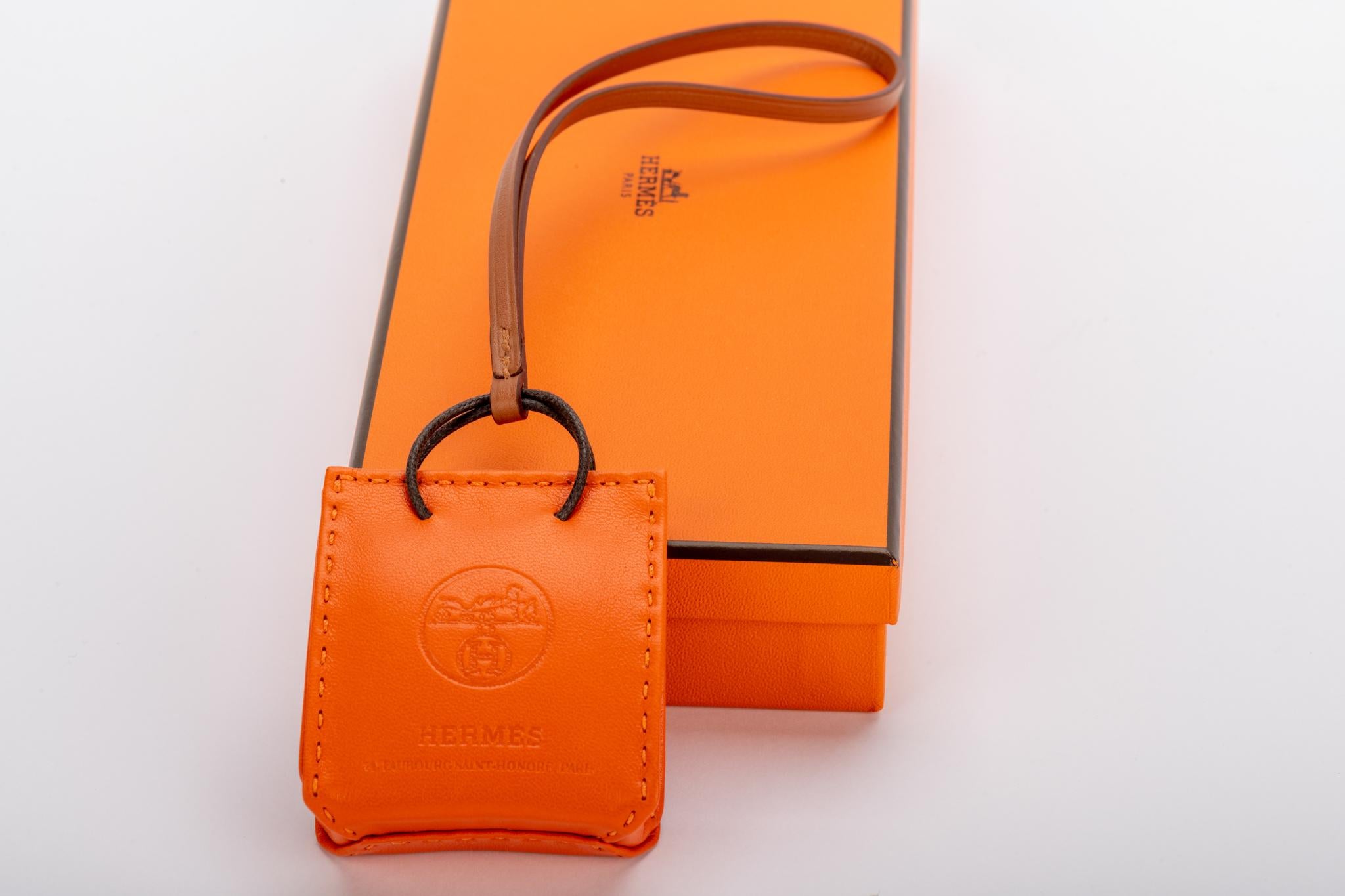 Hermes 2020 collection orange bag charm in swift leather. Brand new with original box.