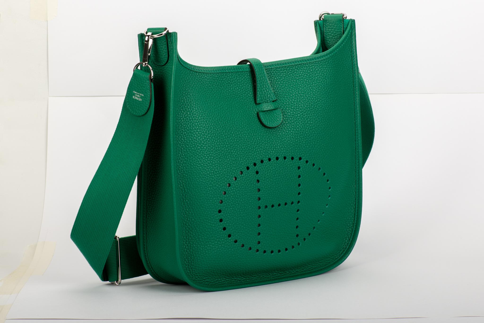 NEW rare Hermès vert vertigo clemence leather medium evelyne with palladium hardware. Adjustable multicolor shoulder strap, can be worn cross body. Date stamp C in a square, 2018. Comes with original duster, shoulder strap, box, ribbon.
