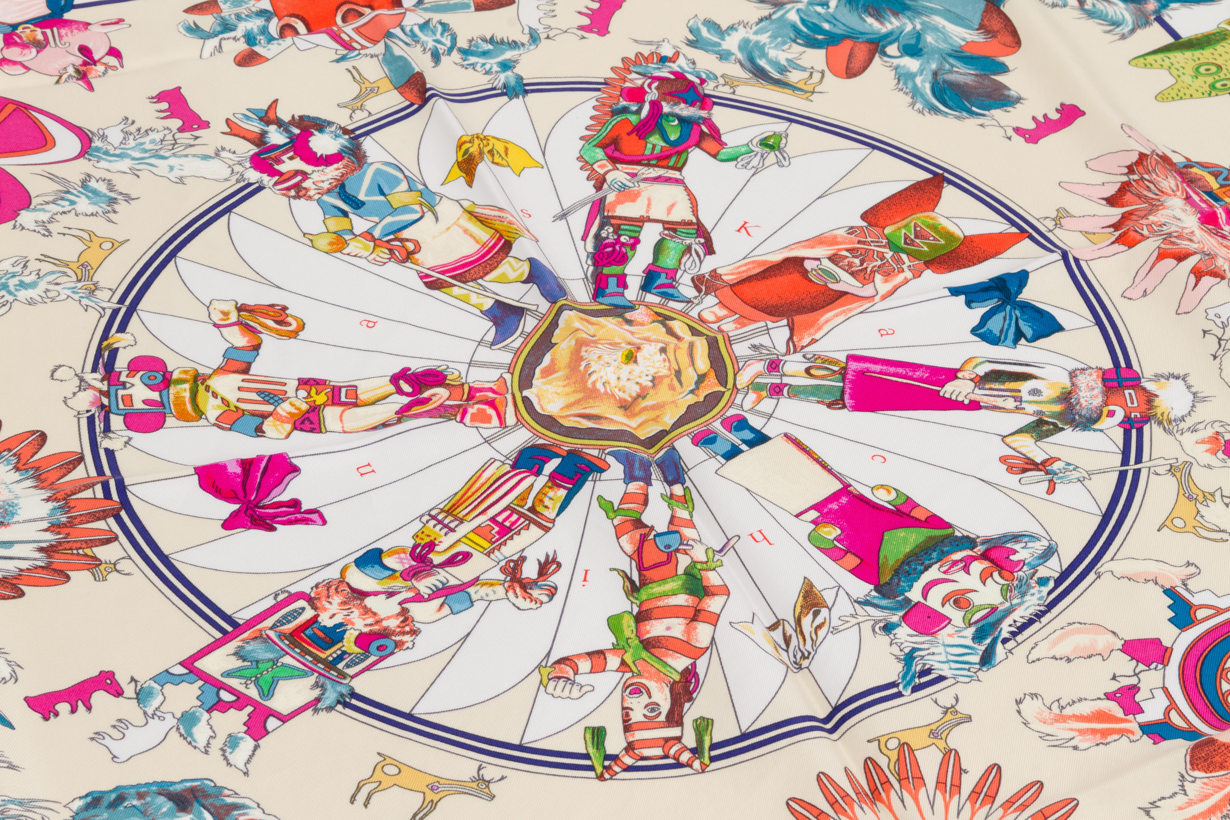 Hermès white, coral and fuchsia silk twill Kachinas scarf designed by Kermit Oliver. Hand-rolled edges. Comes with original box.