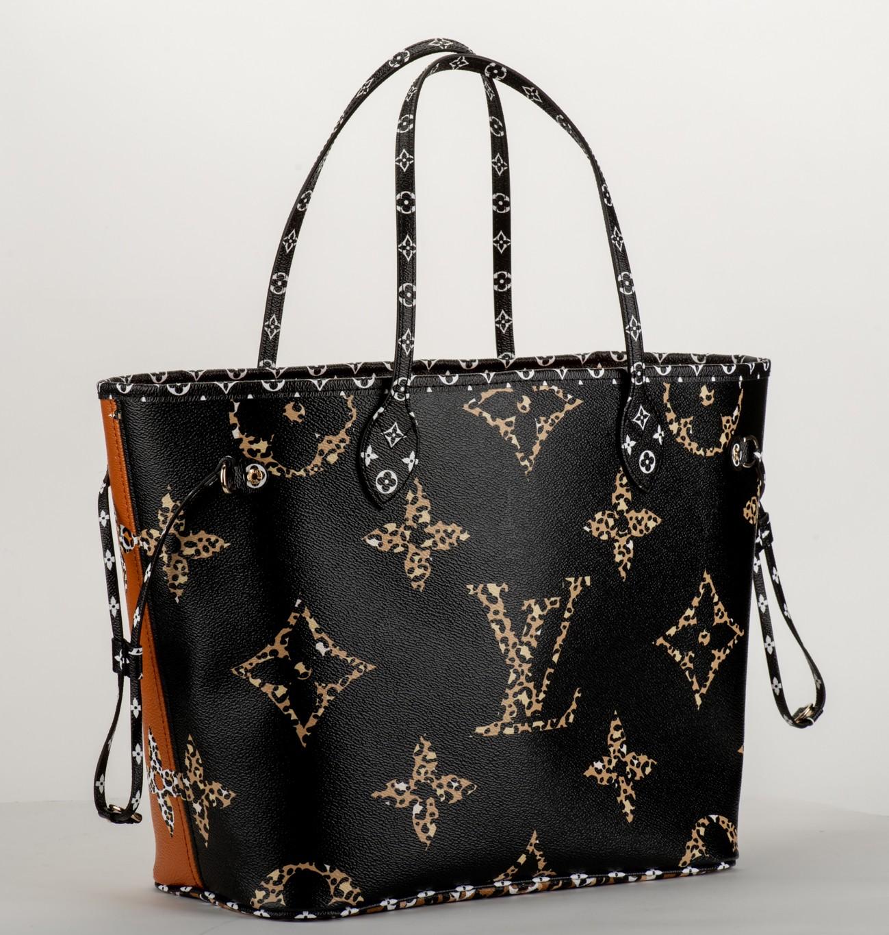 Louis Vuitton limited edition neverfull MM animalier print. Double sided color combination, black and caramel. Interior detachable pouch. Comes with dust cover and original box.