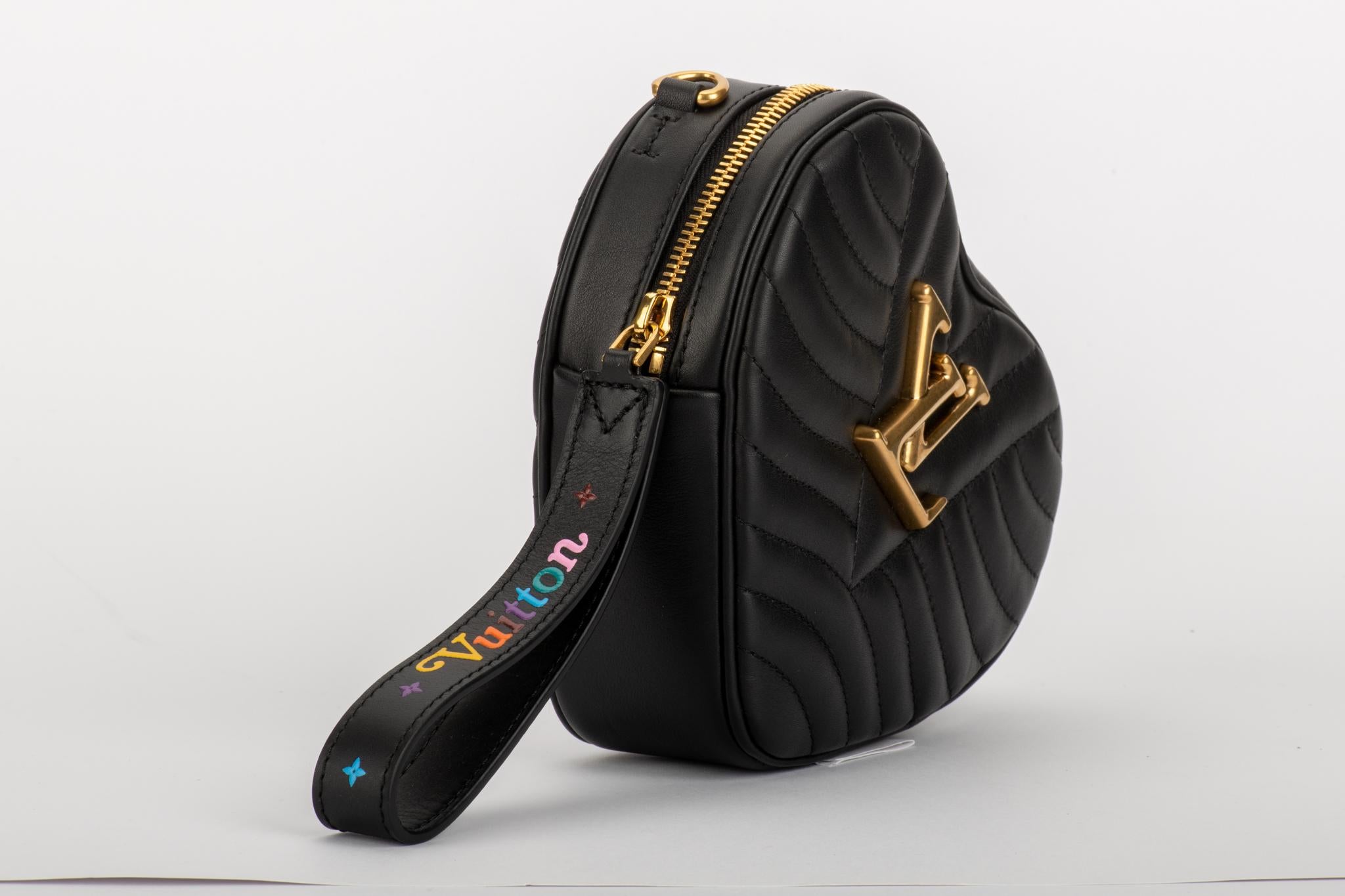 Louis Vuitton limited edition heart shape black leather bag. Can we born as a clutch, waist bag or cross body bag. Shoulder strap 20