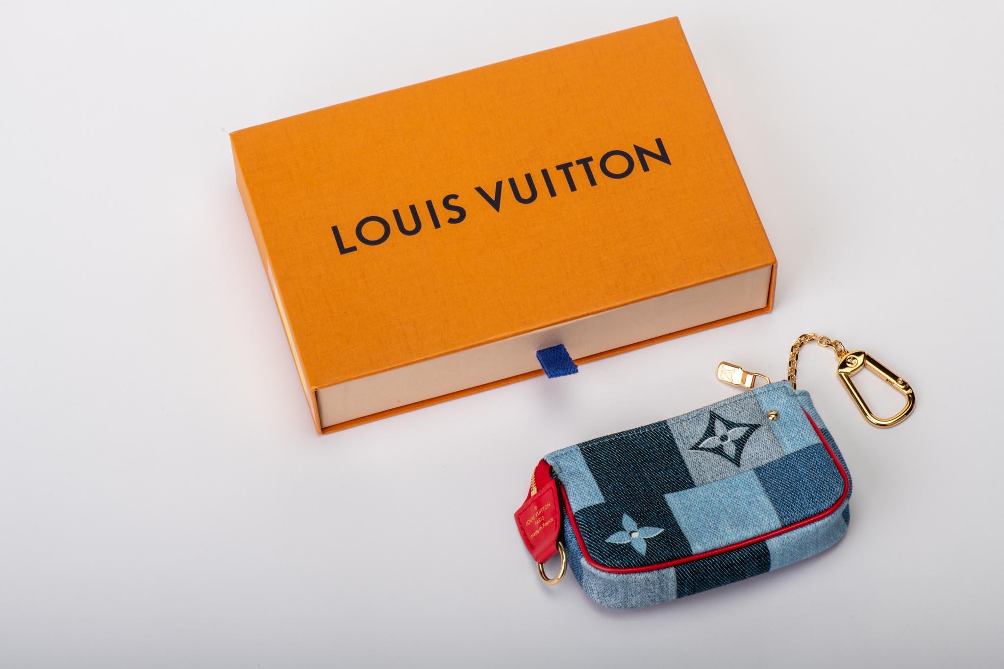 Louis Vuitton denim limited edition micro pouchette in monogram canvas, red leather and gold metal. Comes with original box, brand new.