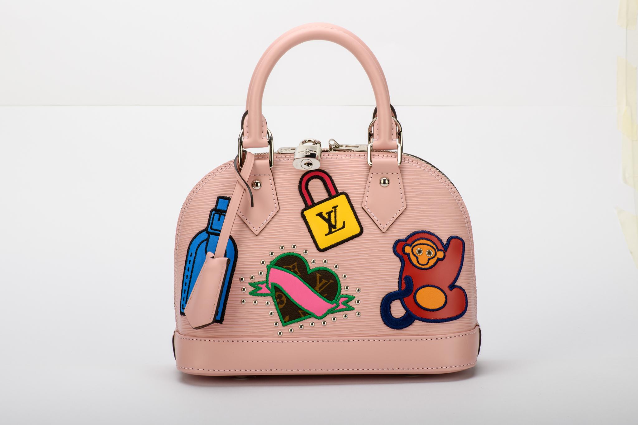 Louis Vuitton limited edition baby pink epi small alma bag with colorful stickers. Handle drop 10cm, shoulder strap 113cm. Comes with lock and 2 keys, dust cover, booklet and box.
