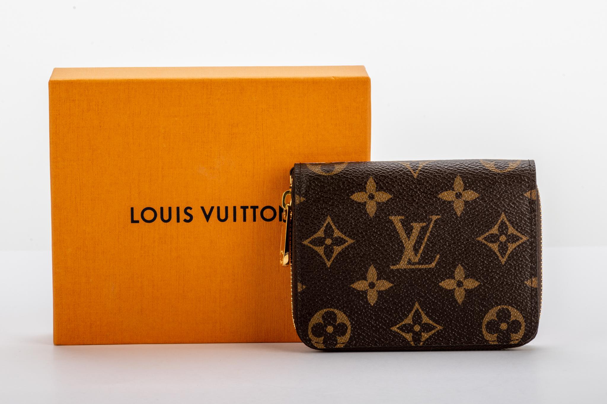 New in box Louis Vuitton limited edition Christmas 2019 Shanghai Hair Balloon zipped wallet. Coated monogram canvas with contrast electric blue leather interior. Comes with dust cover and box.