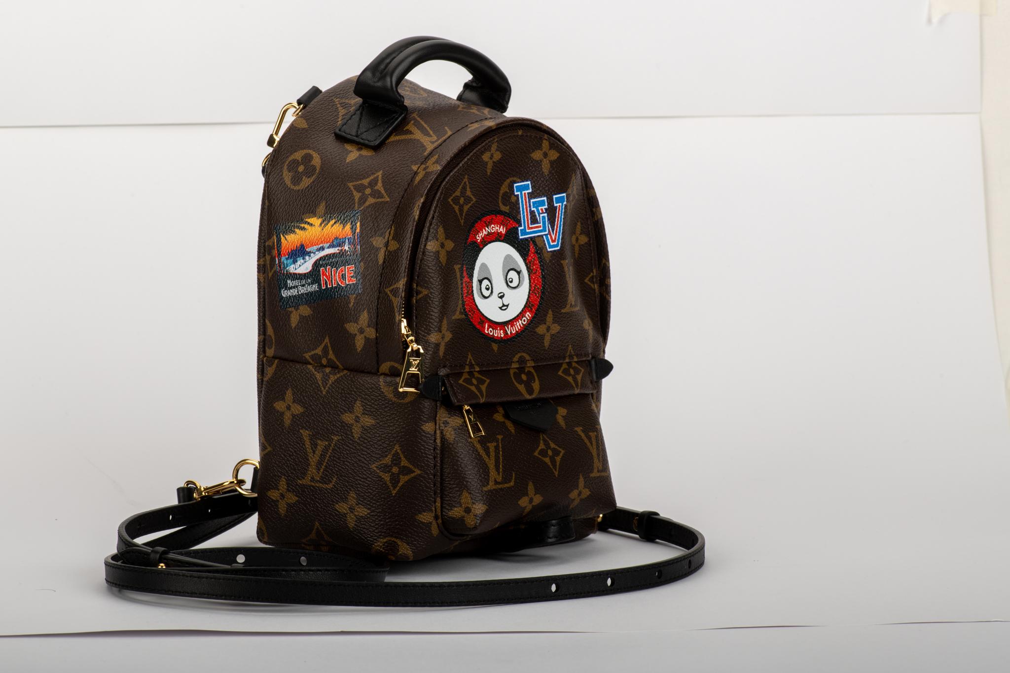 Louis Vuitton limited edition custom order travel stickers mini backpack. Monogram signature canvas with black leather straps. External zipped pocket, internal open pocket. Comes with serial number, dust cover and box.
