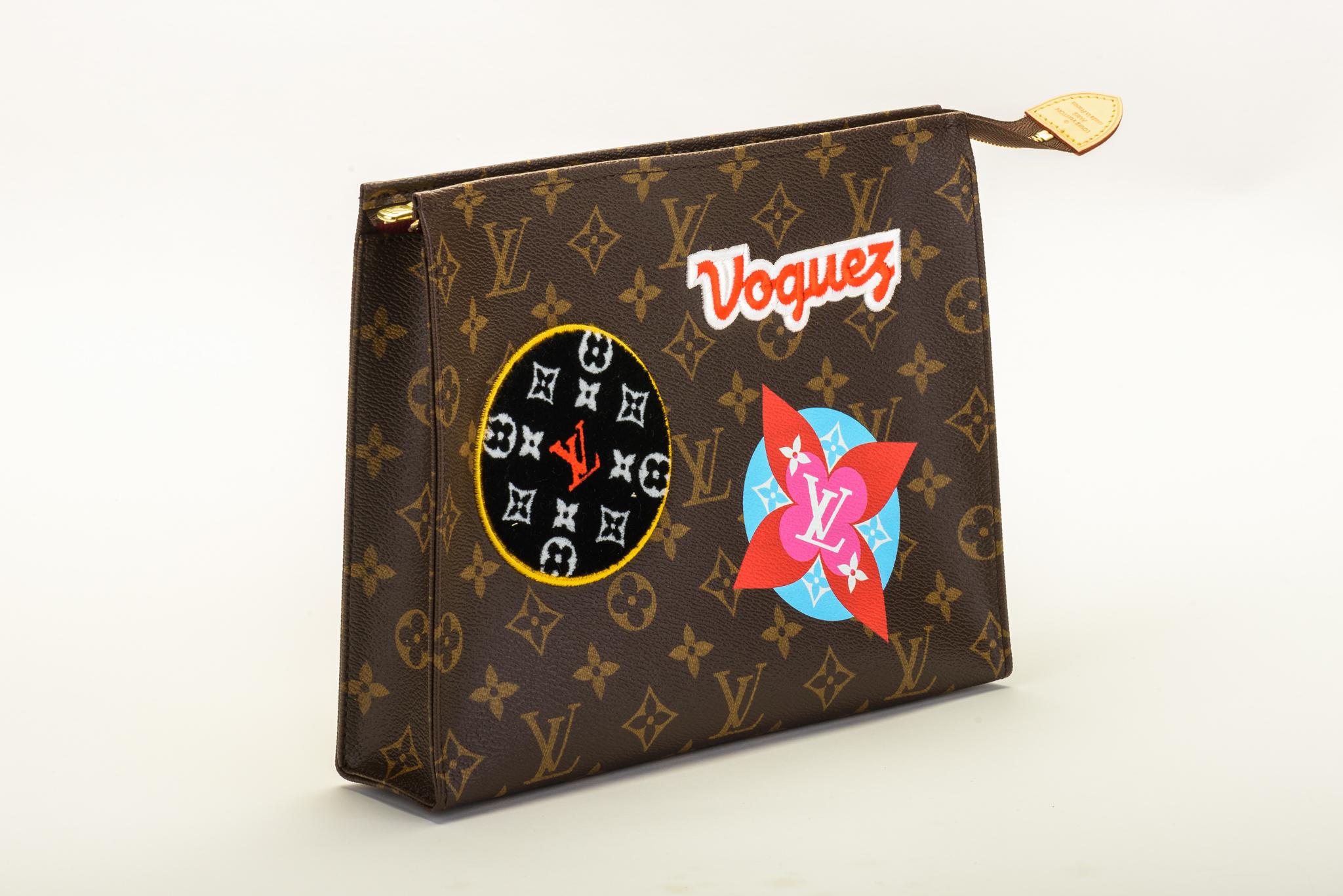 Louis Vuitton limited edition travel stickers pouchette. Sold out everywhere. Comes with dust cover and shopping bag. No box included. 