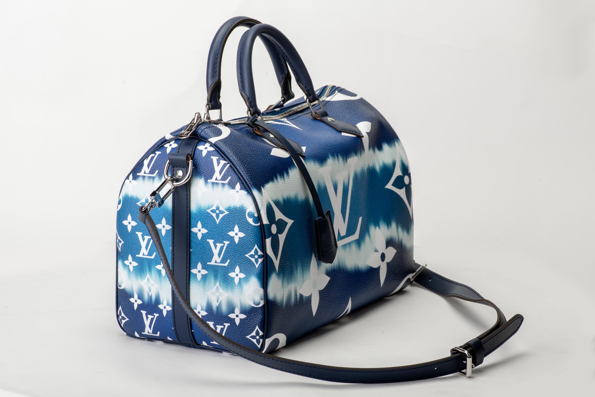 Louis Vuitton limited edition speedy 30 bandouliere in escale tie die print. Blue leather details and silver tone hardware. Comes with dust cover and original box. Box slightly damaged.