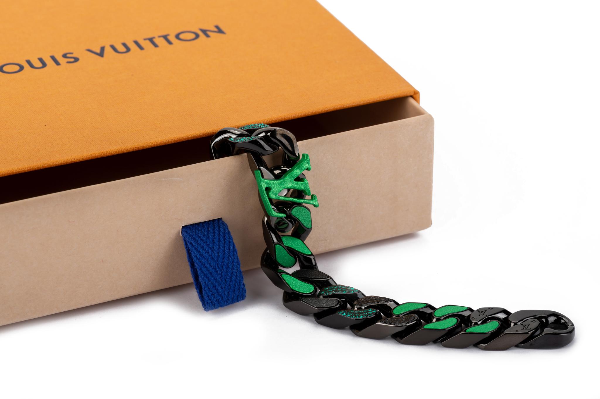Louis Vuitton brand new link bracelet designed by Virgil Abloh. Highly collectible and sold out. 2020 collection. Gunmetal logo embossed chain with green and black rhinestones anad enamel LV logo . Comes with protective plastic, velvet pouch and