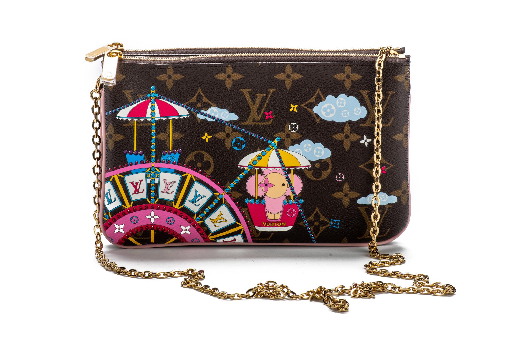 Louis Vuitton limited edition double pochette in coated monogram canvas with Ferris Wheel 2020 Christmas design. Double zipped compartments with middle open pocket, can be used as a pochette or as a cross body. Comes with original dust cover and