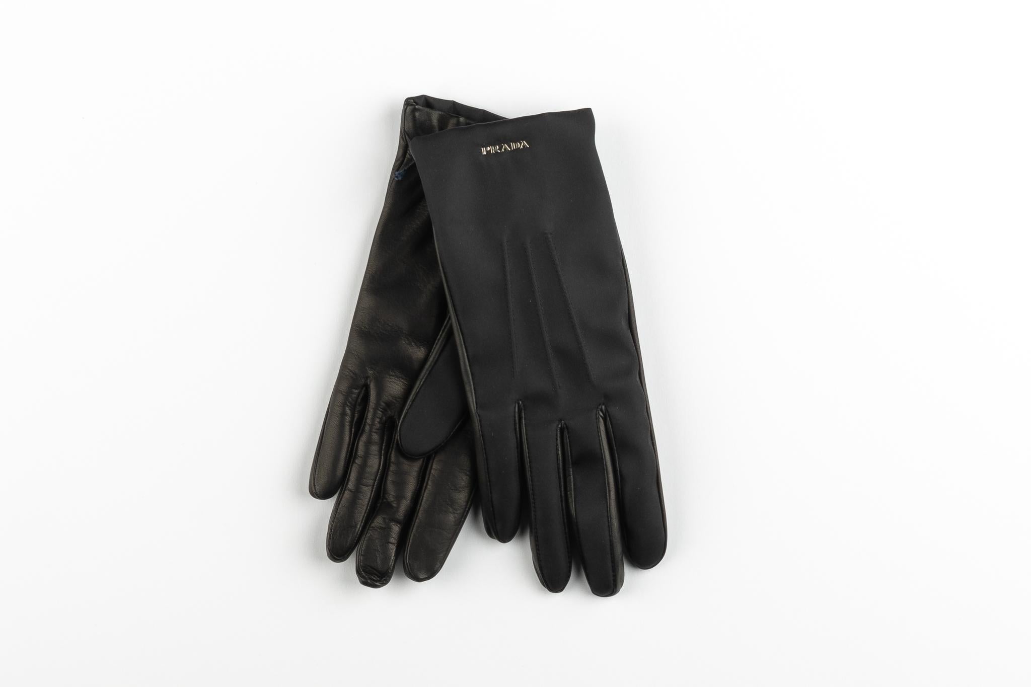 Prada made in Italy black leather ladies gloves . Brand new with tag and box. Size 6.5.
