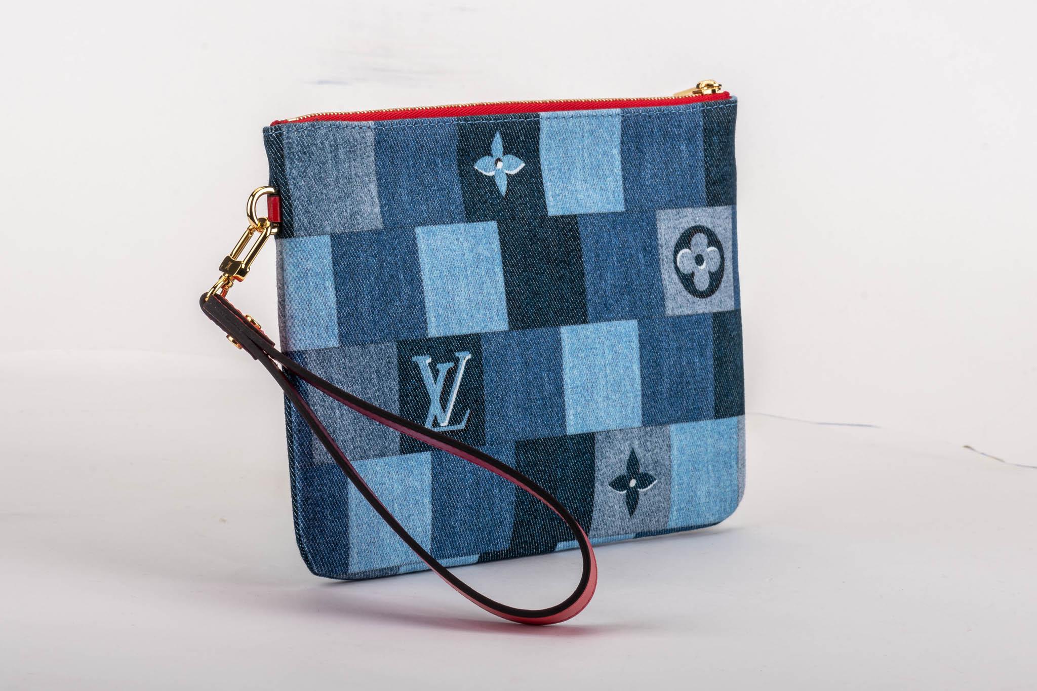 Louis Vuitton limited edition denim pouchette with red leather details. Detachable handle. Comes with booklet, dust cover, original box and ribbon.