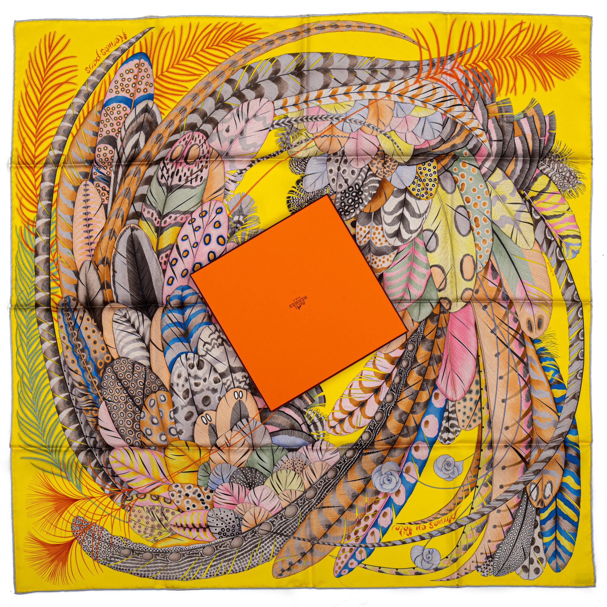 Hermes new in box yellow silk scarf with feathers design. Hand rolled edges. Comes with original box.
