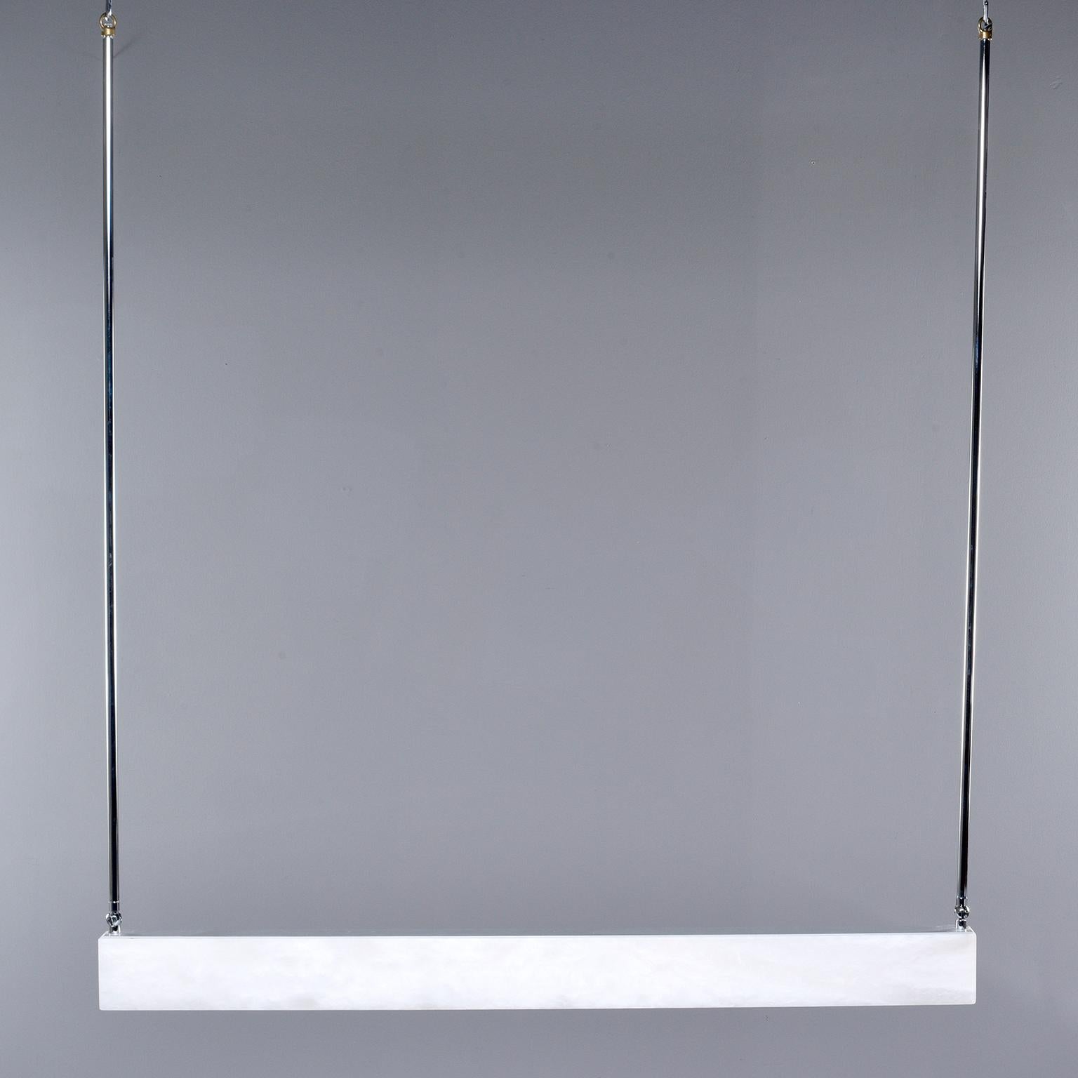 New Italian alabaster rectangular light with chrome fittings

Custom made for us by Italian artisans, this fixture features a sleek rectangular alabaster bar with LED lights and chrome fittings that can be hung in a triangular configuration or