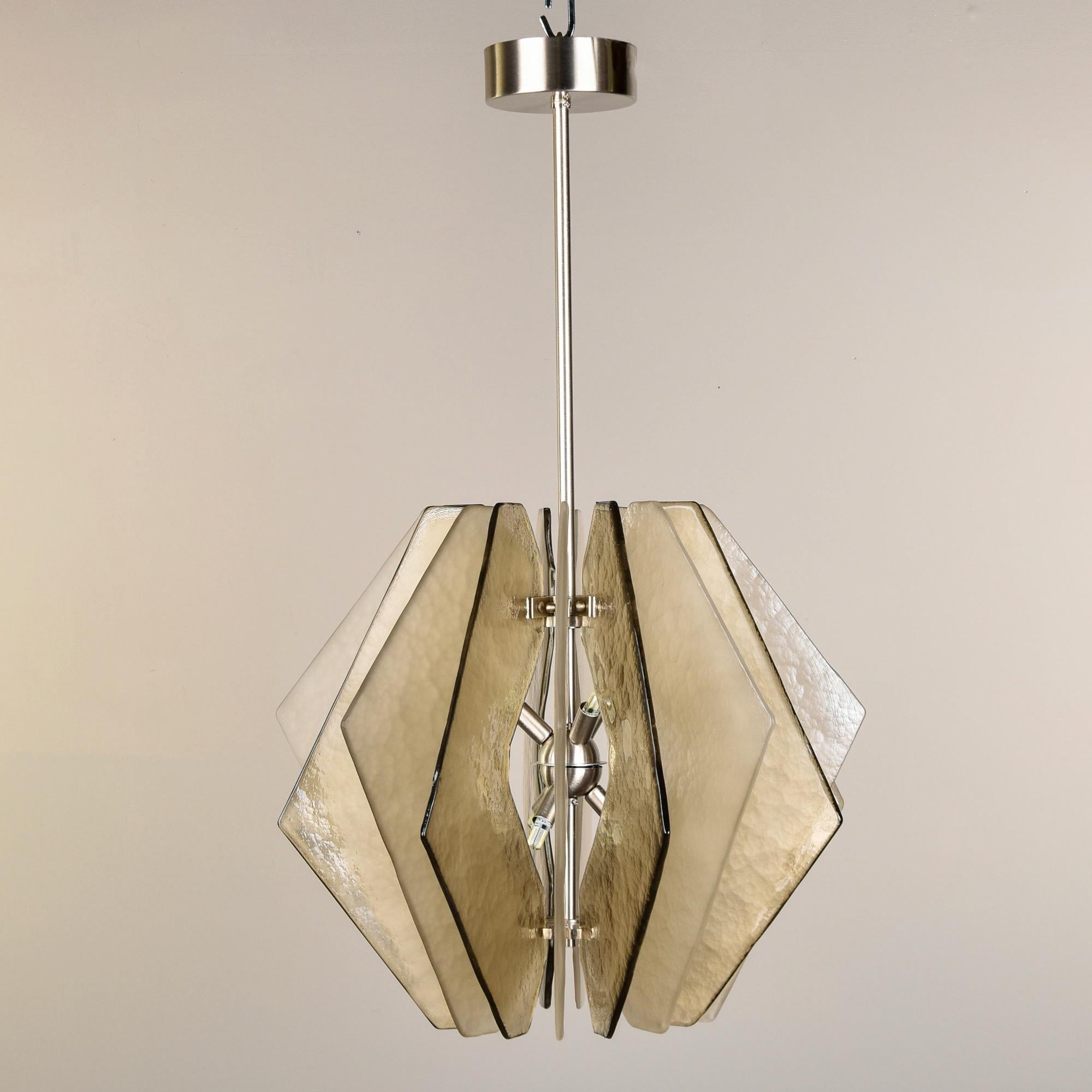 New chandelier made in Italy with Murano glass panels. Polished chrome hardware and canopy, six light fixture with heavy textured taupe colored glass panels arranged so that the glossy and satin finishes alternate.  Unknown maker. New wiring for US