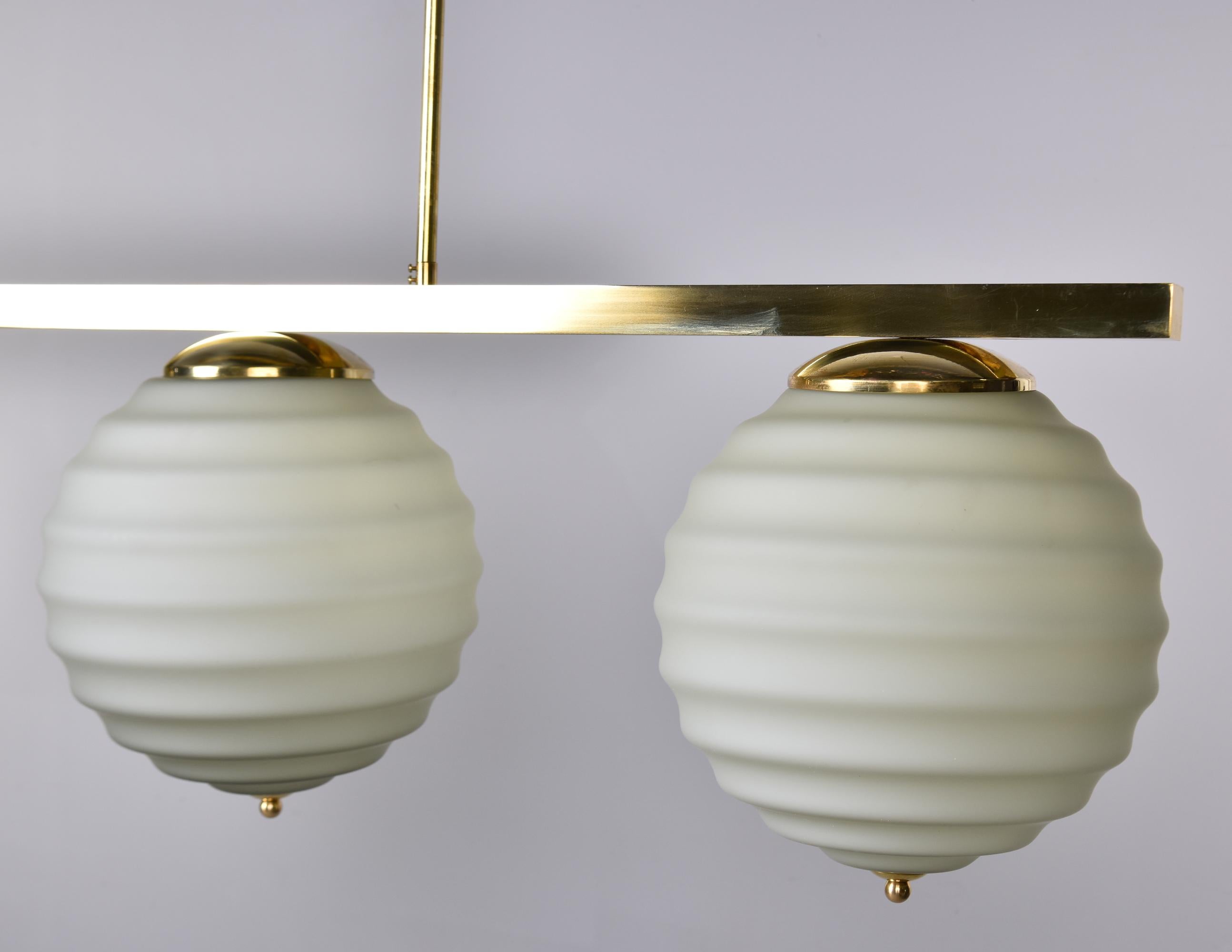 New Italian Fixture with Four Pale Taupe Globes on Horizontal Brass Bar For Sale 7