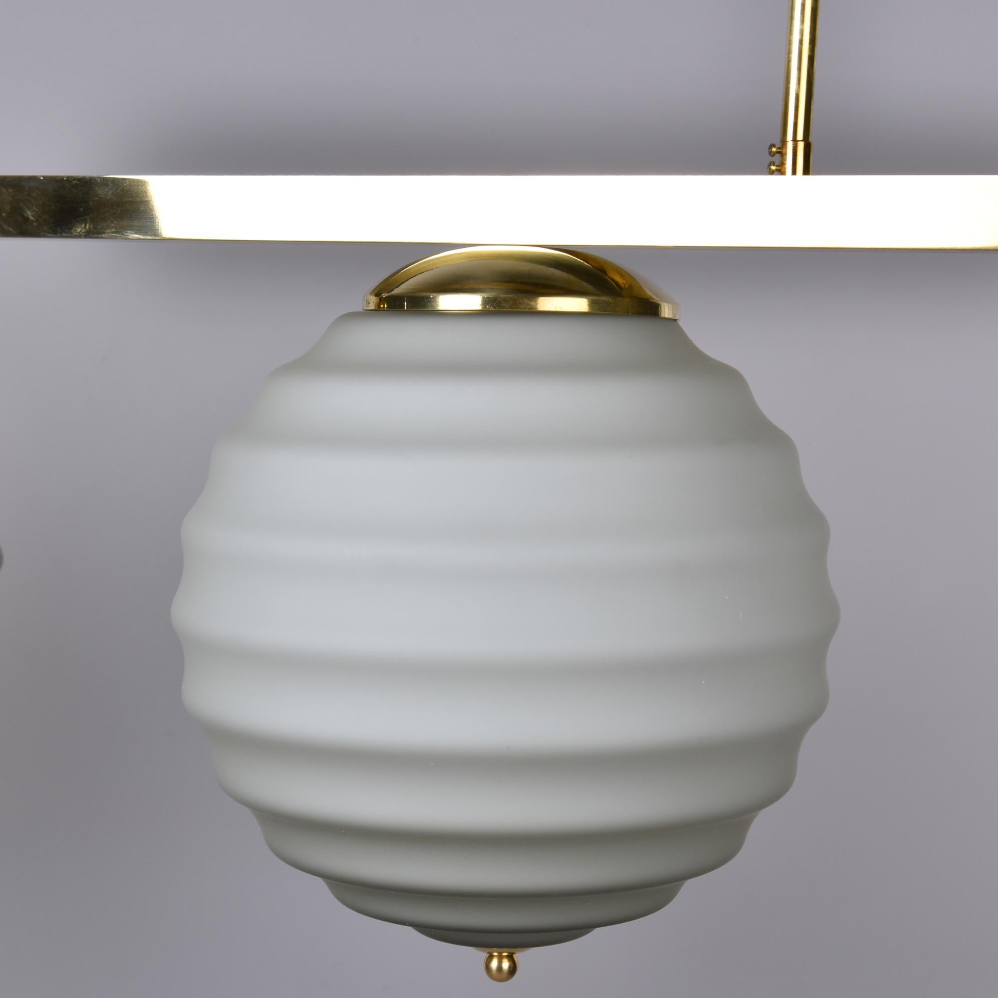 New Italian Fixture with Four Pale Taupe Globes on Horizontal Brass Bar For Sale 3