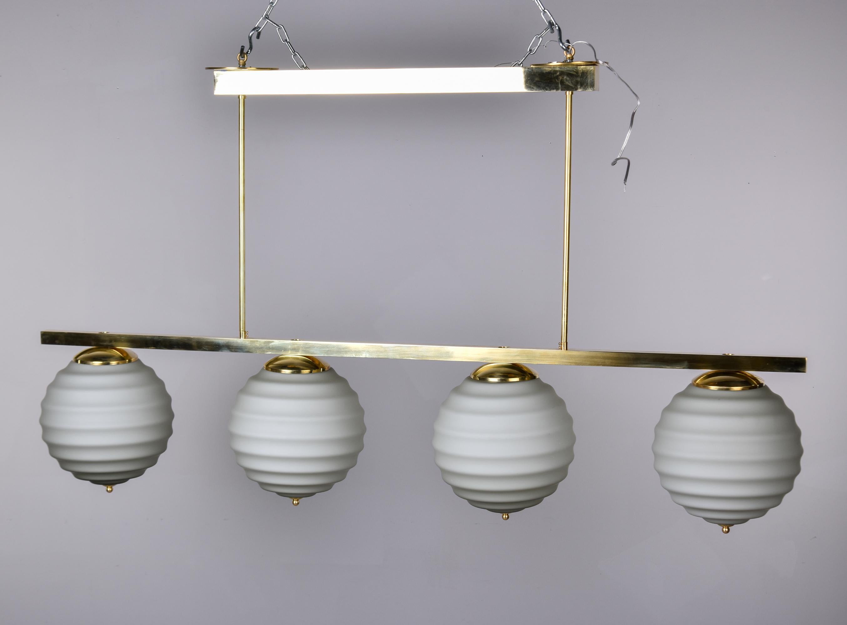 New Italian Fixture with Four Pale Taupe Globes on Horizontal Brass Bar For Sale 4