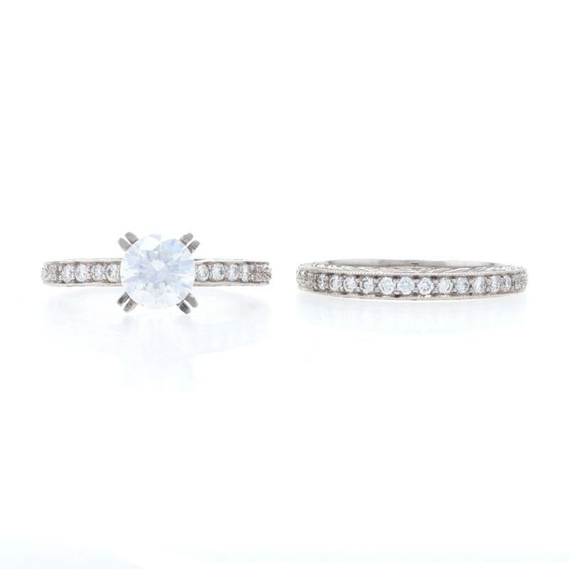 Inspired by romantic vintage designs, this NEW 18k white gold bridal set by Jabel is sure to delight your sweetheart! The semi-mount engagement ring will accommodate a round cut diamond or gemstone of your choosing. Both the engagement piece and the