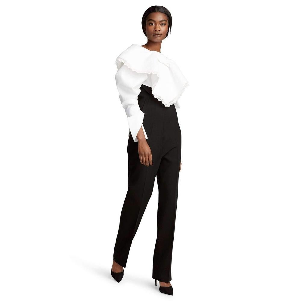 You've heard of high rise trousers, but you've probably never seen a silhouette that reaches the dizzying heights of this JACQUEMUS pair. 
Extending up to the bust, you'll find them to have a slimming effect as they streamline everything below a