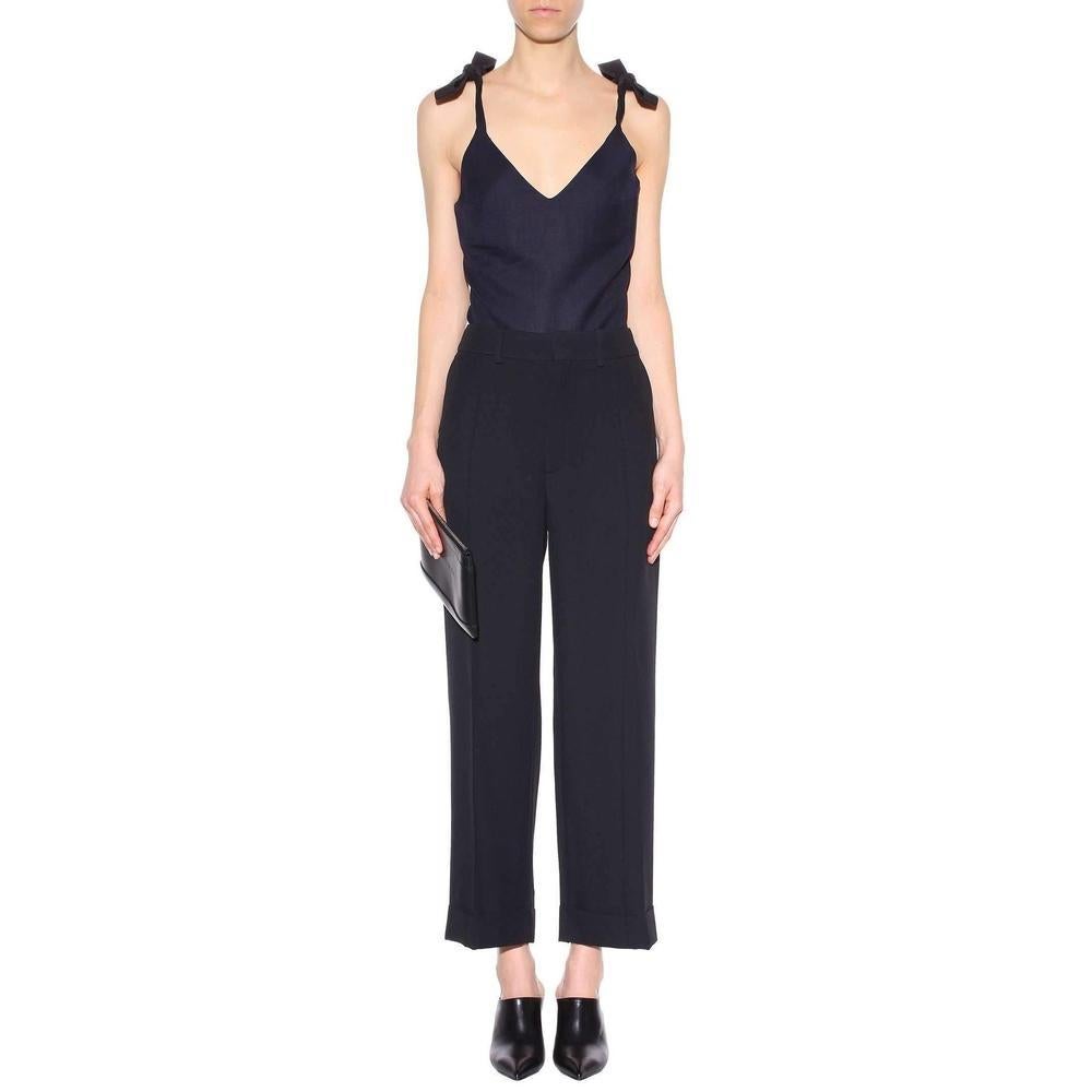 This sleeveless top, crafted from navy-hued wool, comes from Jacquemus' romantic collection, inspired by the traditional Provençal look. 
Cut in a loose shape and finished with a low-cut neck, the piece features ribbons that tie at the shoulders for