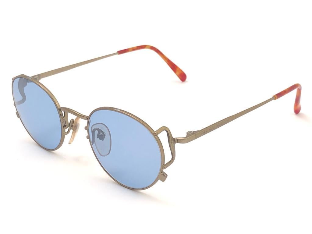 New Jean Paul Gaultier small oval matte frame. 
Spotless lenses that complete a ready to wear JPG look.

Amazing design with strong yet intricate details.
Design and produced in the 1990's.
New, never worn or displayed.
This item may show minor sign