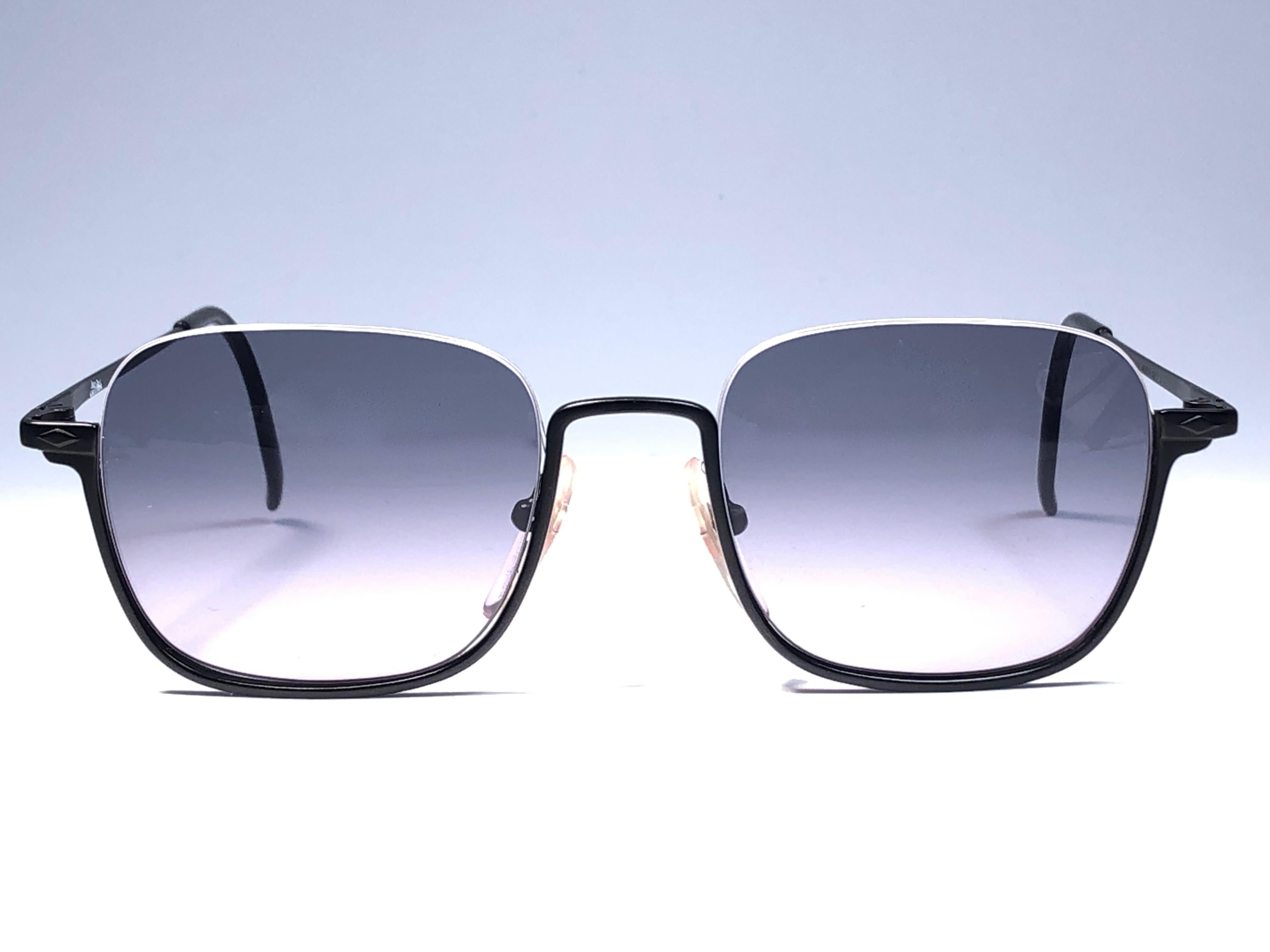 New Jean Paul Gaultier medium half frame sunglasses.
Spotless smoke grey lenses that complete a ready to wear JPG look.

Amazing design with strong yet intricate details.
Design and produced in the 1990's.
New, never worn or displayed.
This item may