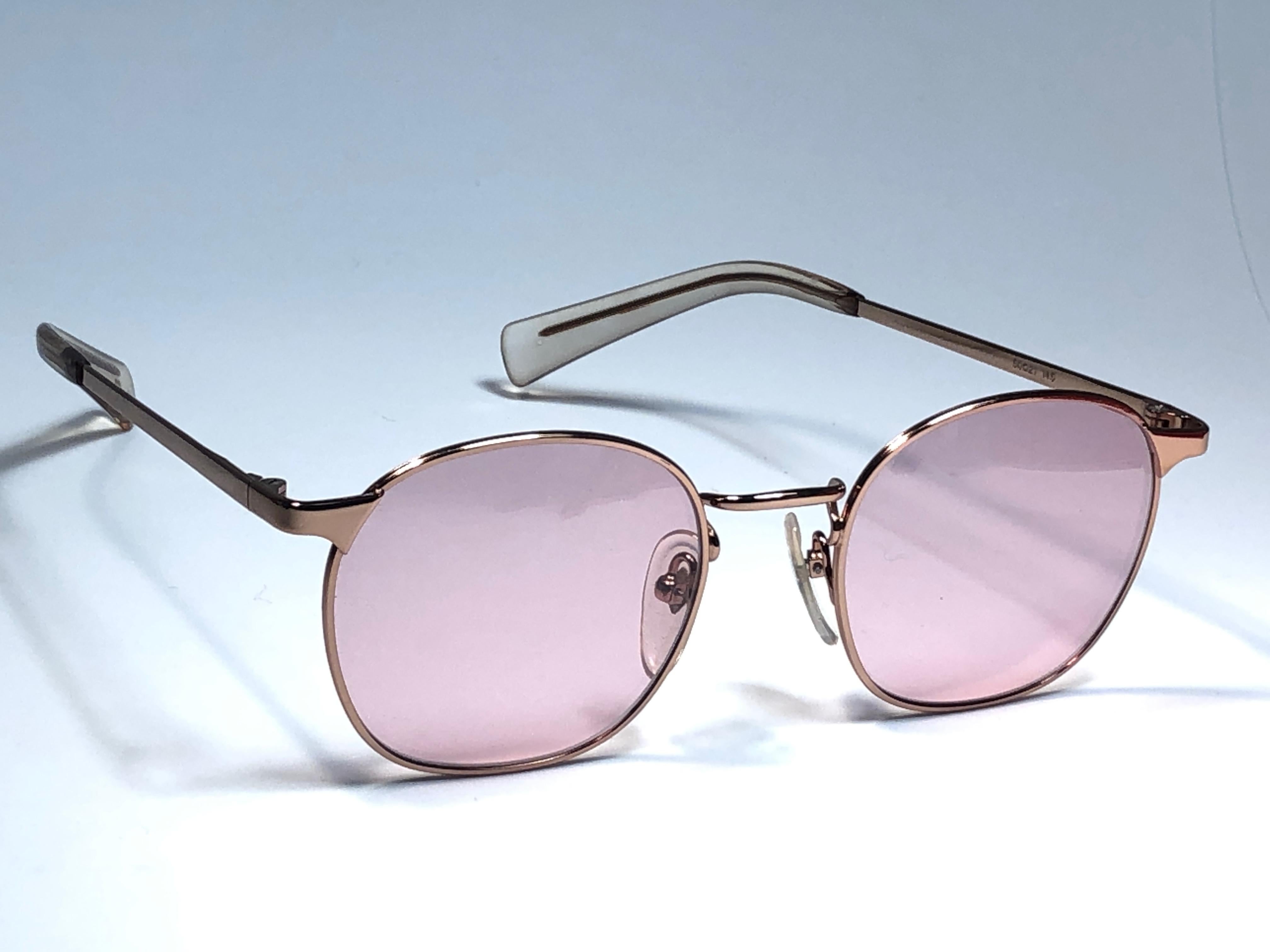 New Jean Paul Gaultier medium oval gold frame sunglasses.
Light rose lenses that complete a ready to wear JPG look.

Amazing design with strong yet intricate details.
Design and produced in the 1990's.
New, never worn or displayed.
This item may