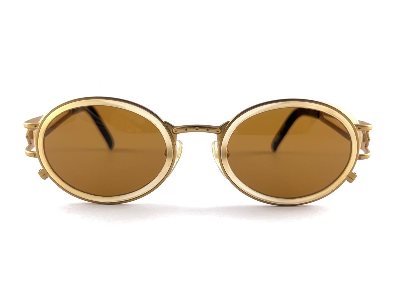 
 Vintage Jean Paul Gaultier Metallic Gold Oval Frame. 
Medium Brown Lenses That Complete A Ready To Wear Jpg Look. 
Amazing Design With Strong And Elaborated Details. 
Made In The 1990'S. 
A True Fashion Statement. 
This Item Show Minor Sign Of