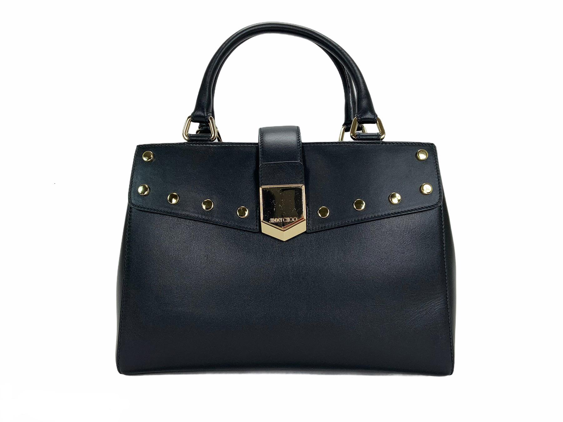 New Jimmy Choo *Lockett* Handbag Tote
Black Leather, Gold-Tone Hardware, Medium Size, Magnetic Snap Closure, Center Zip Pocket, One Interior Side Pocket. 
Dual Rolled Top Handles, Black Interior Lining.
Measurements: W - 12 inches, H - 8.5