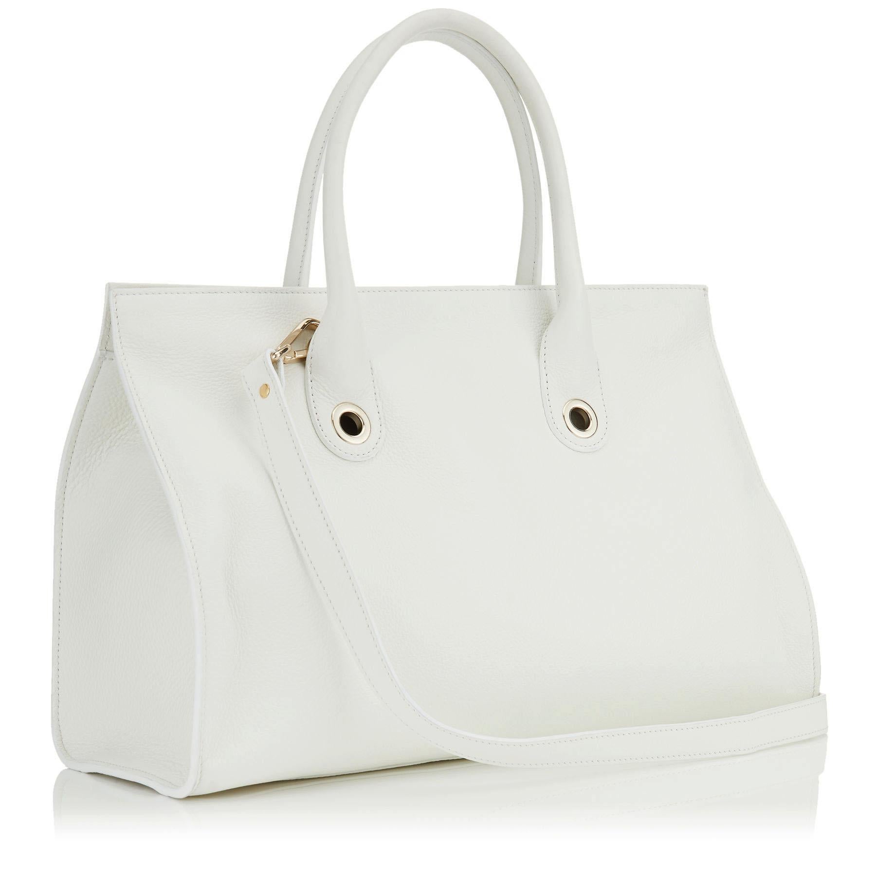 This popular Jimmy Choo Riley's Grainy Calf Leather Cross-body Bag in White. The over sized tote bag is trimmed with gold-toned hardware. The opening features a flip-lock closure at front and 4 protective metal feet on bottom. The removable and