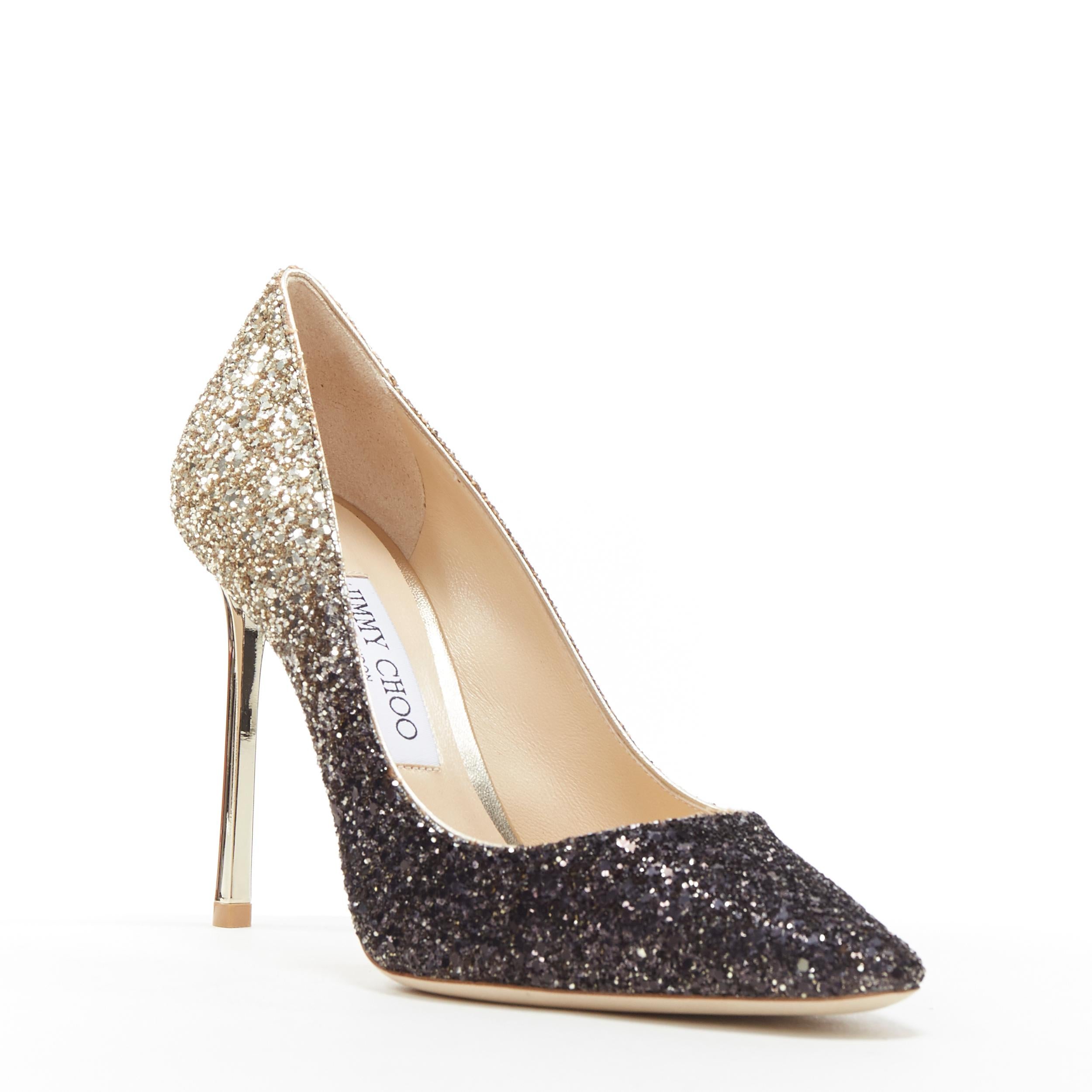 new JIMMY CHOO Romy 100 black gold gradient course glitter pointy toe pump EU37
Brand: Jimmy Choo
Designer: Jimmy Choo
Model Name / Style: Romy 100
Material: Leather
Color: Gold
Pattern: Solid
Closure: Slip on
Extra Detail: Leather upper covered in